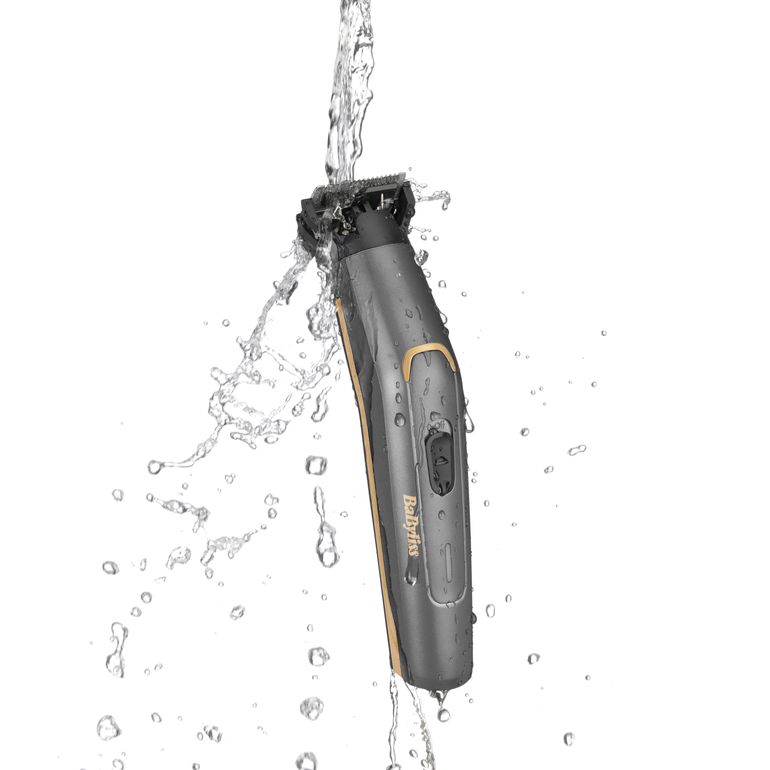 A black and gold Babyliss trimmer being rinsed with water. Water splashes around it.