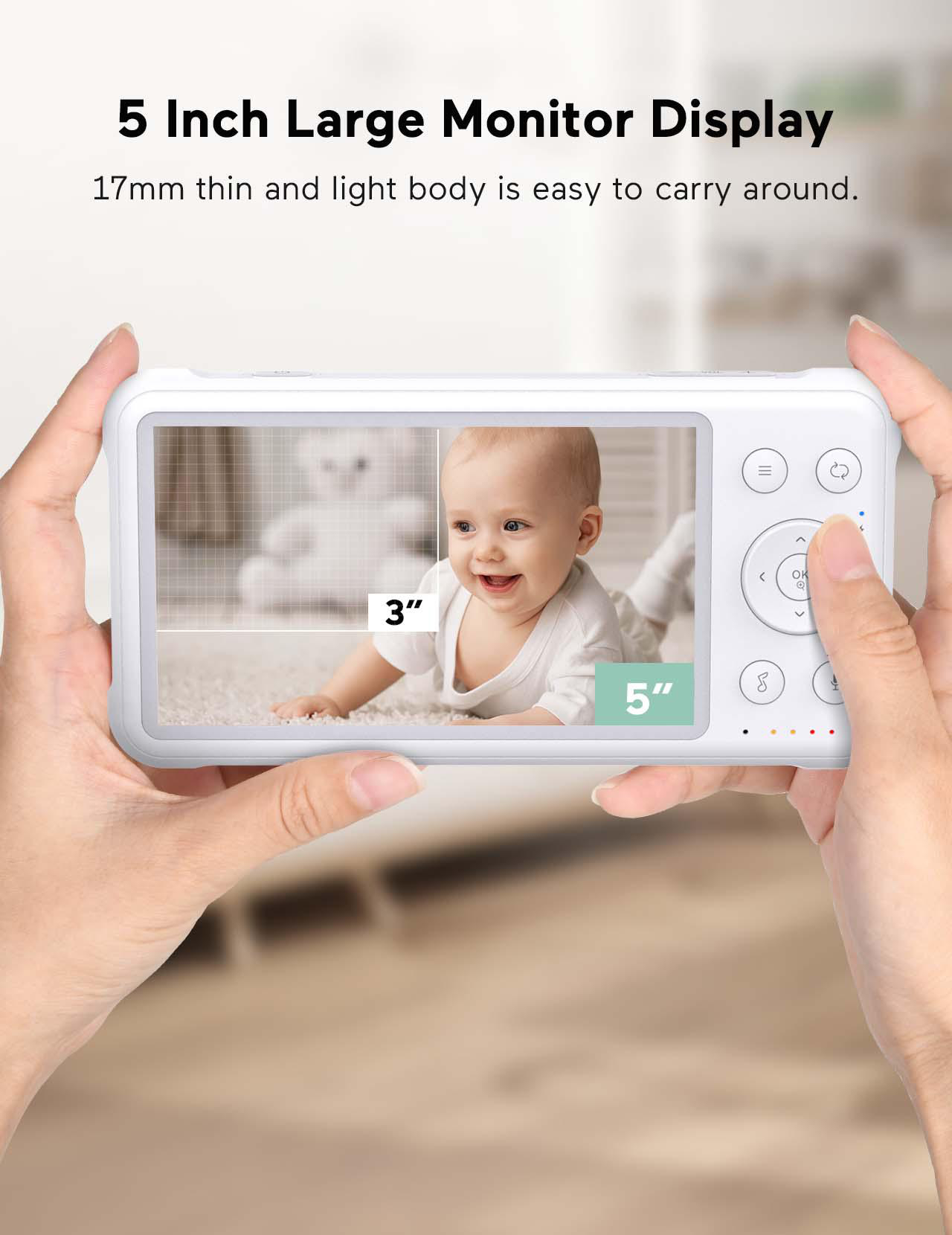 Ein Babyphone-Bildschirm, der ein Baby zeigt, das von zwei Händen gehalten wird.