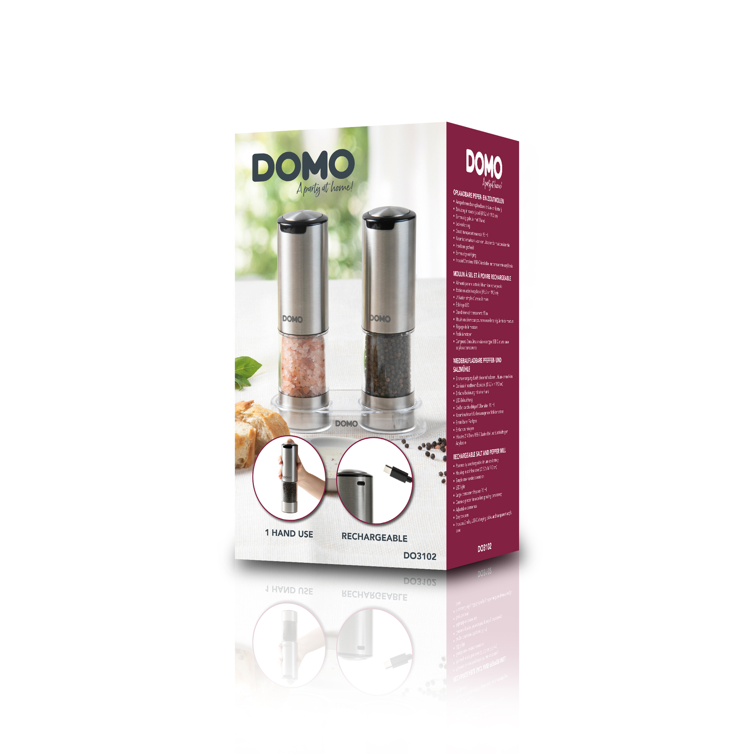 Boxed salt and pepper grinder set. Silver grinders. Food and text visible. White background.