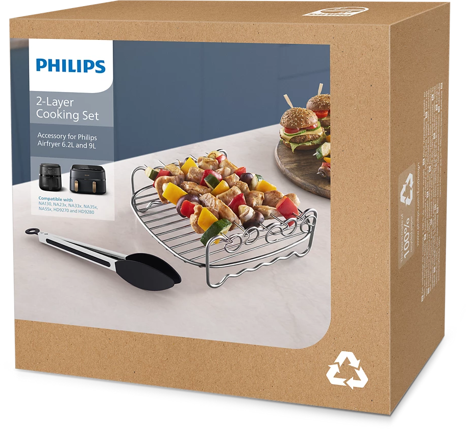 Dobozos Philips 2 rétegű főzőkészlet tartozékokkal. Nyársakat és hamburgereket mutat.