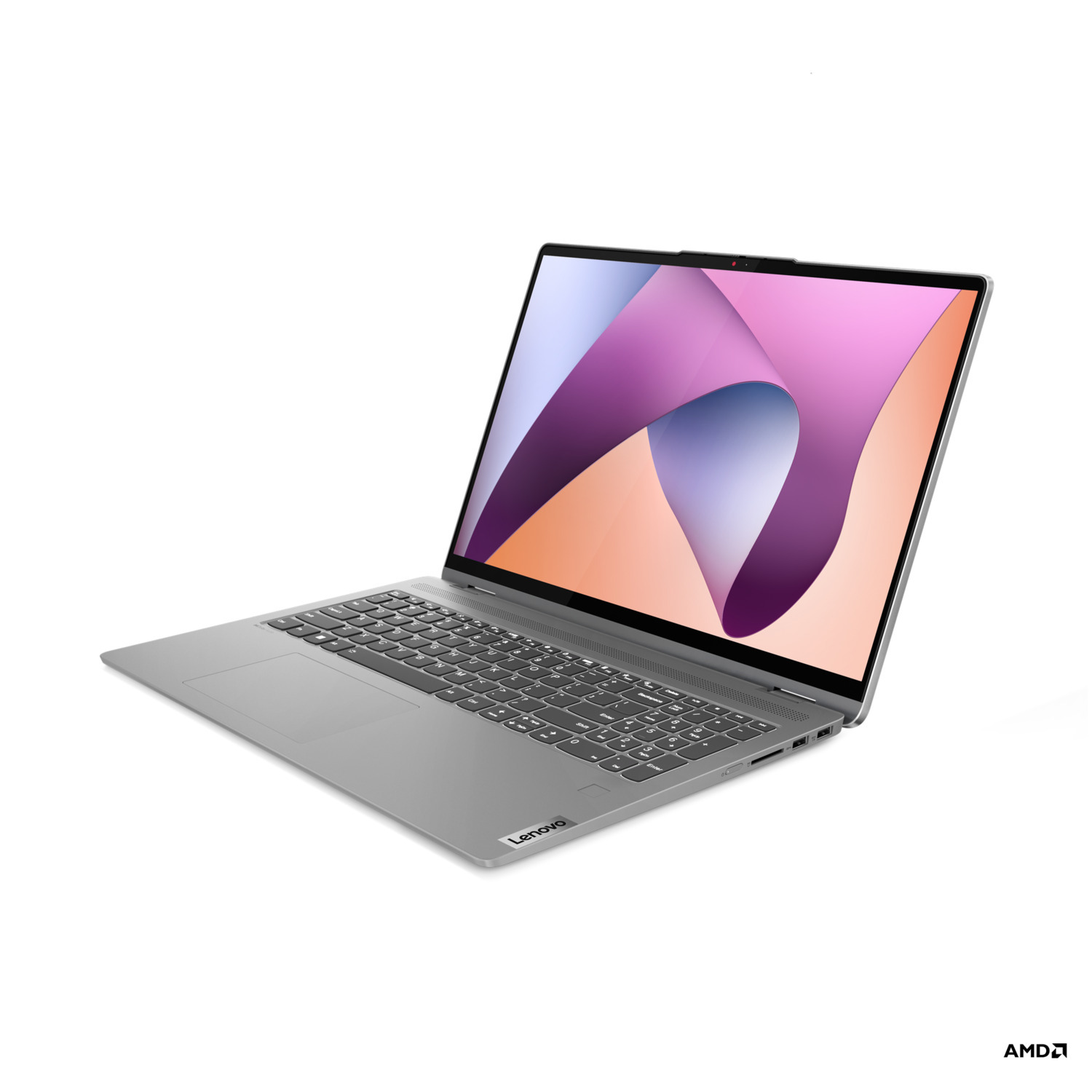 Ordinateur portable Lenovo argenté, ouvert. Écran rose/orange, fond blanc.