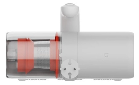 Biała wyciskarka do soku z czerwonymi częściami, wtyczką i przezroczystym pojemnikiem.