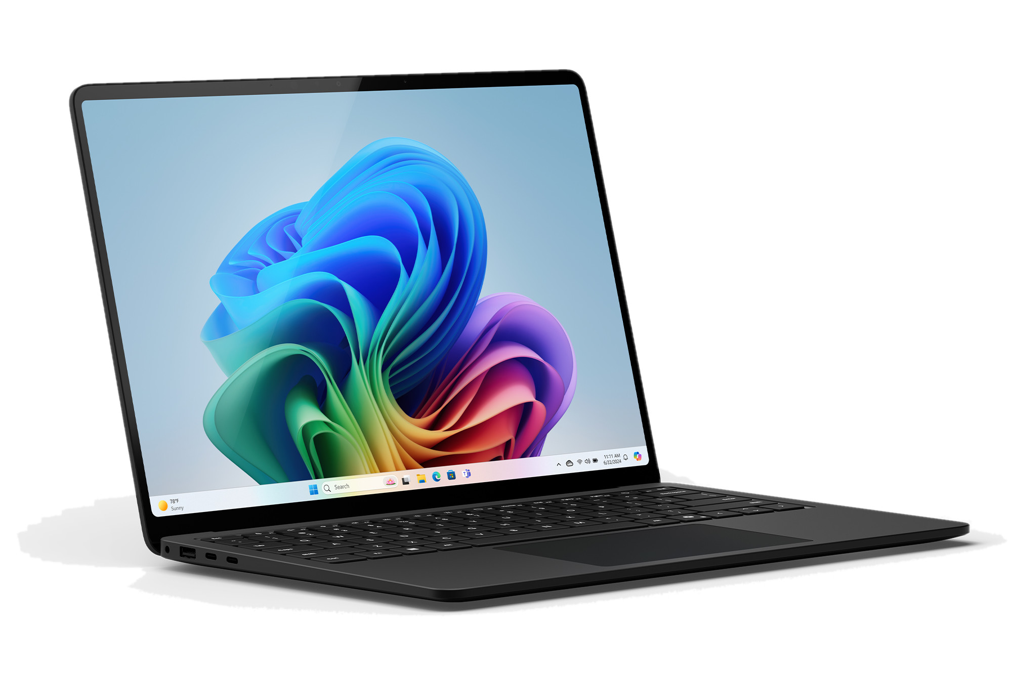 Czarny laptop, otwarty, pod kątem, z kolorowym abstrakcyjnym tłem na ekranie.