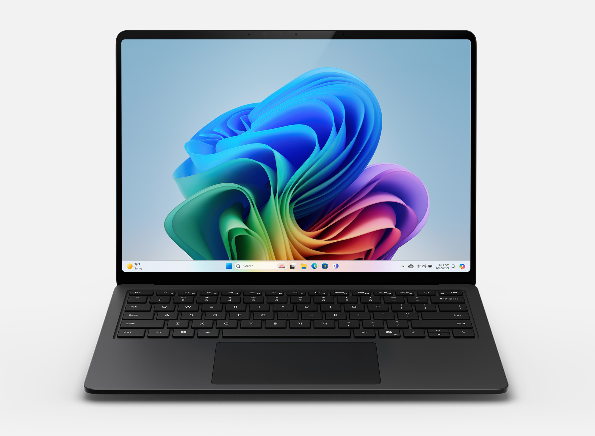 Czarny laptop wyświetla kolorowy abstrakcyjny obraz na ekranie. Laptop stoi na białym tle.