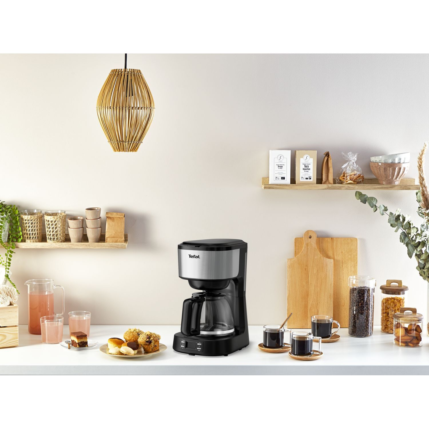 Coffee maker and breakfast on a counter.
