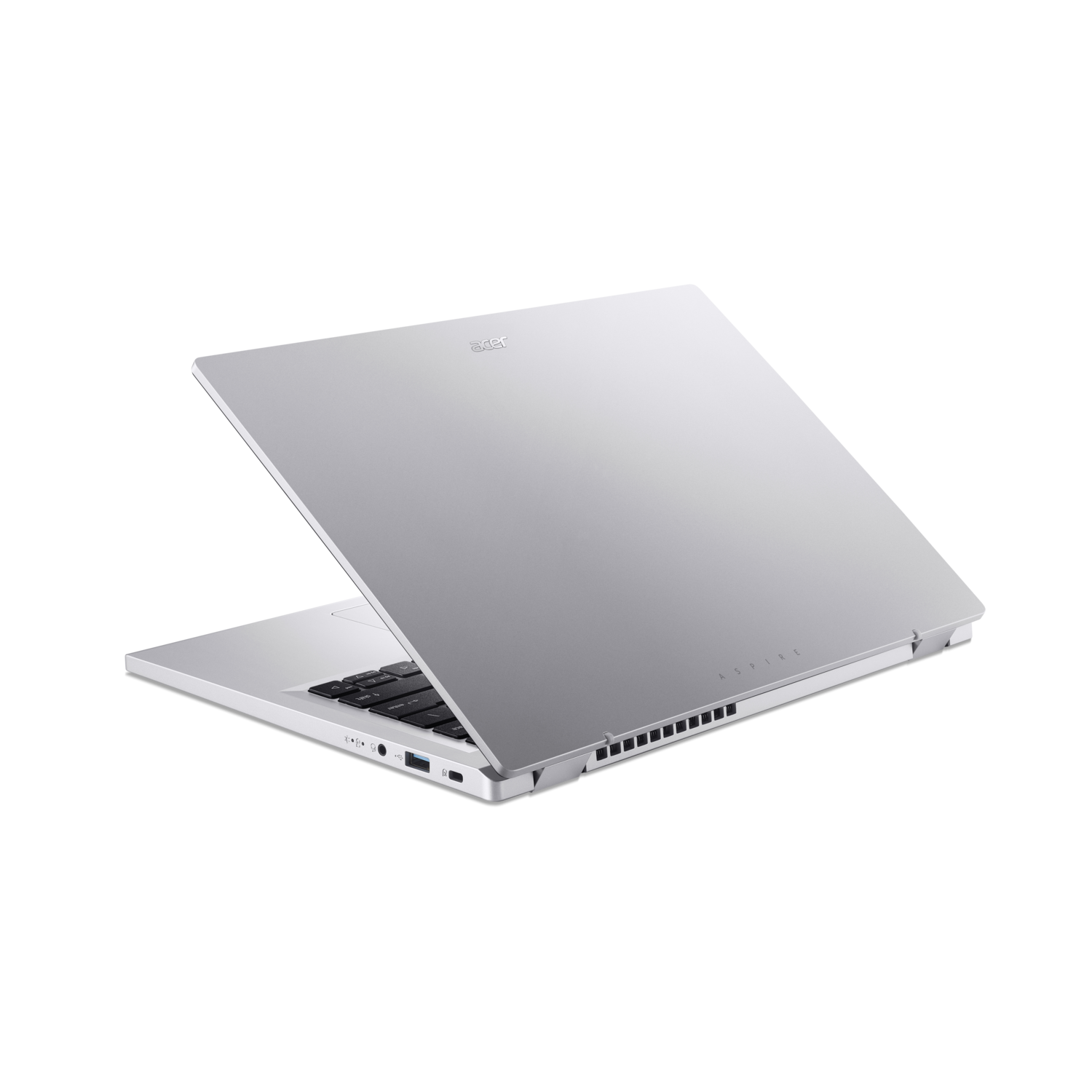 Silver laptop, angled view, open with the screen facing up. Black background.