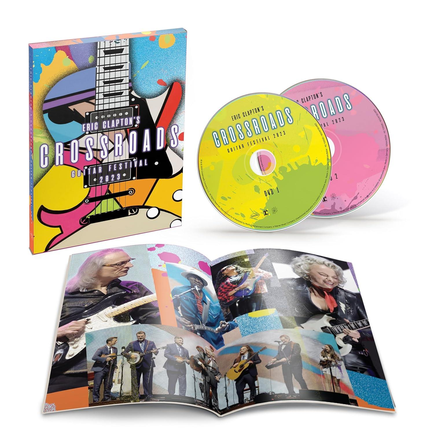 A box set and CDs featuring Eric Clapton's Crossroads Guitar Festival 2023, plus an open booklet.
