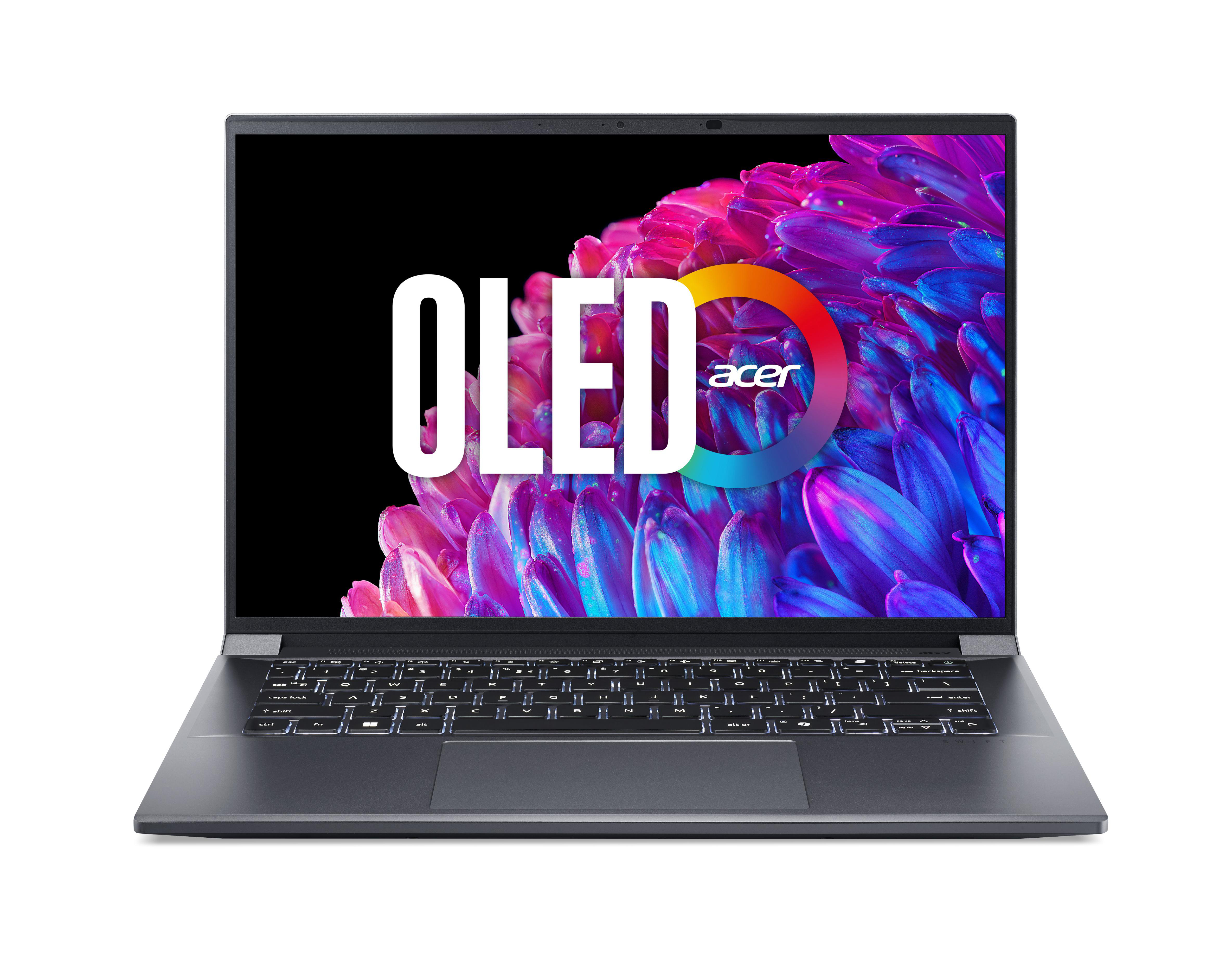 Silberner Laptop mit 'OLED'-Text auf dem Bildschirm.