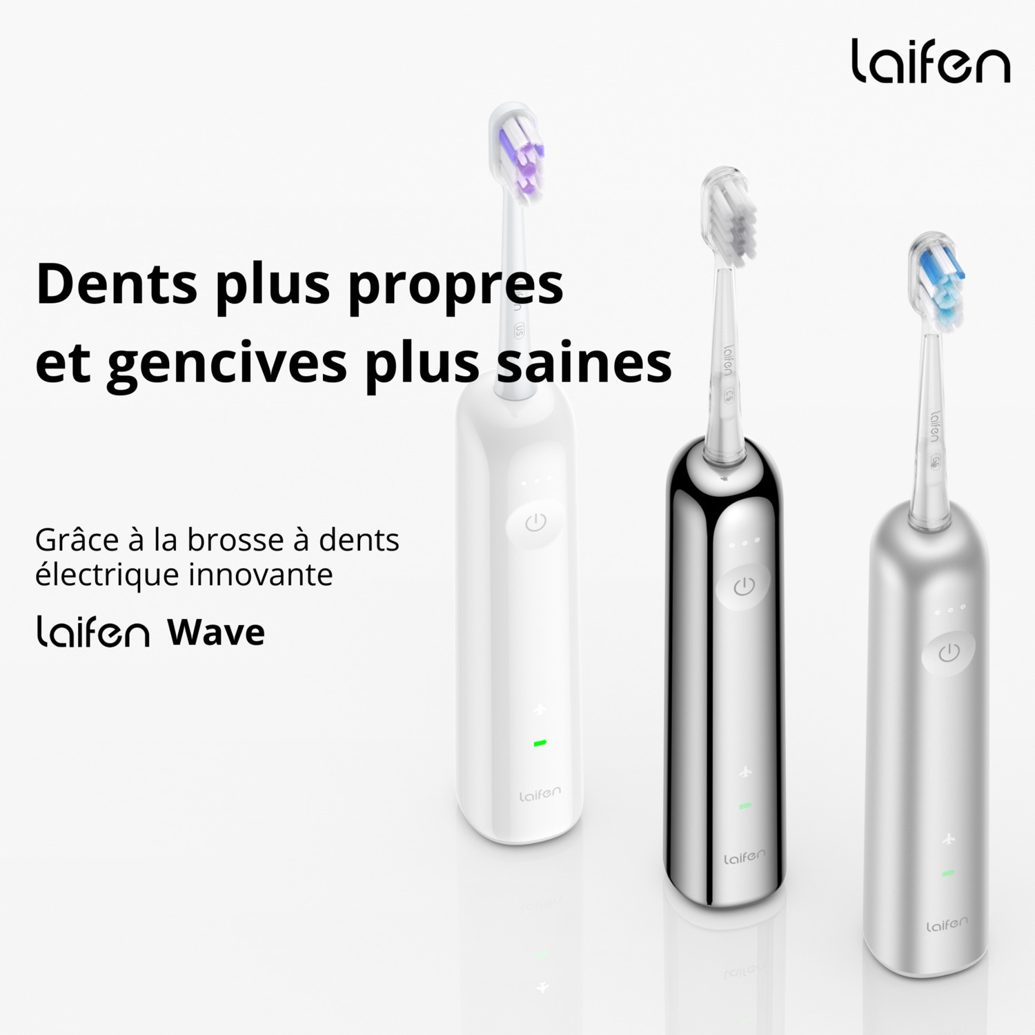 Trois brosses à dents électriques, blanches, noires et argentées. Promotion des dents et des gencives propres.
