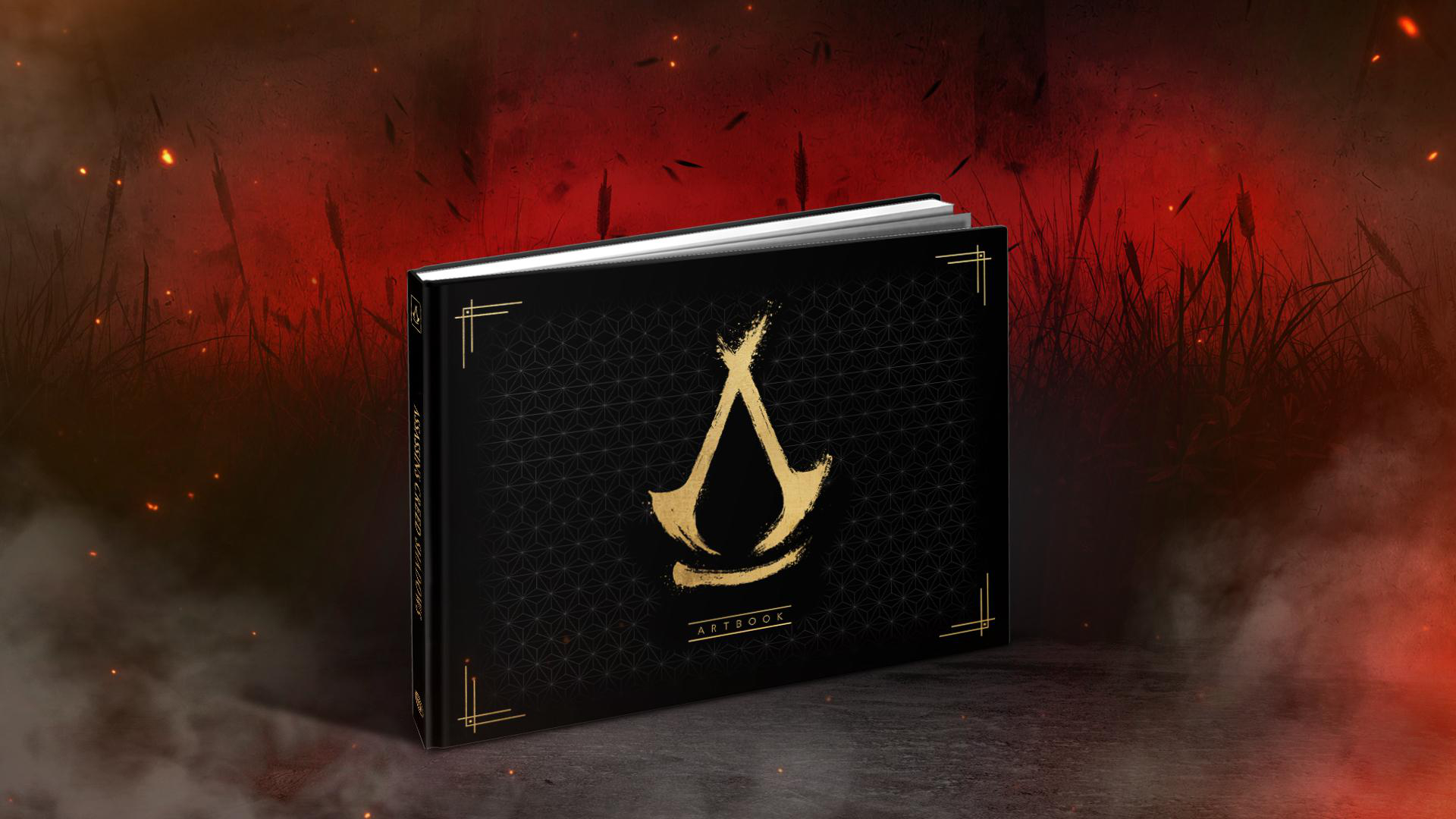 Ein Artbook mit schwarzem Einband und goldenen Details, auf unscharfem Hintergrund.