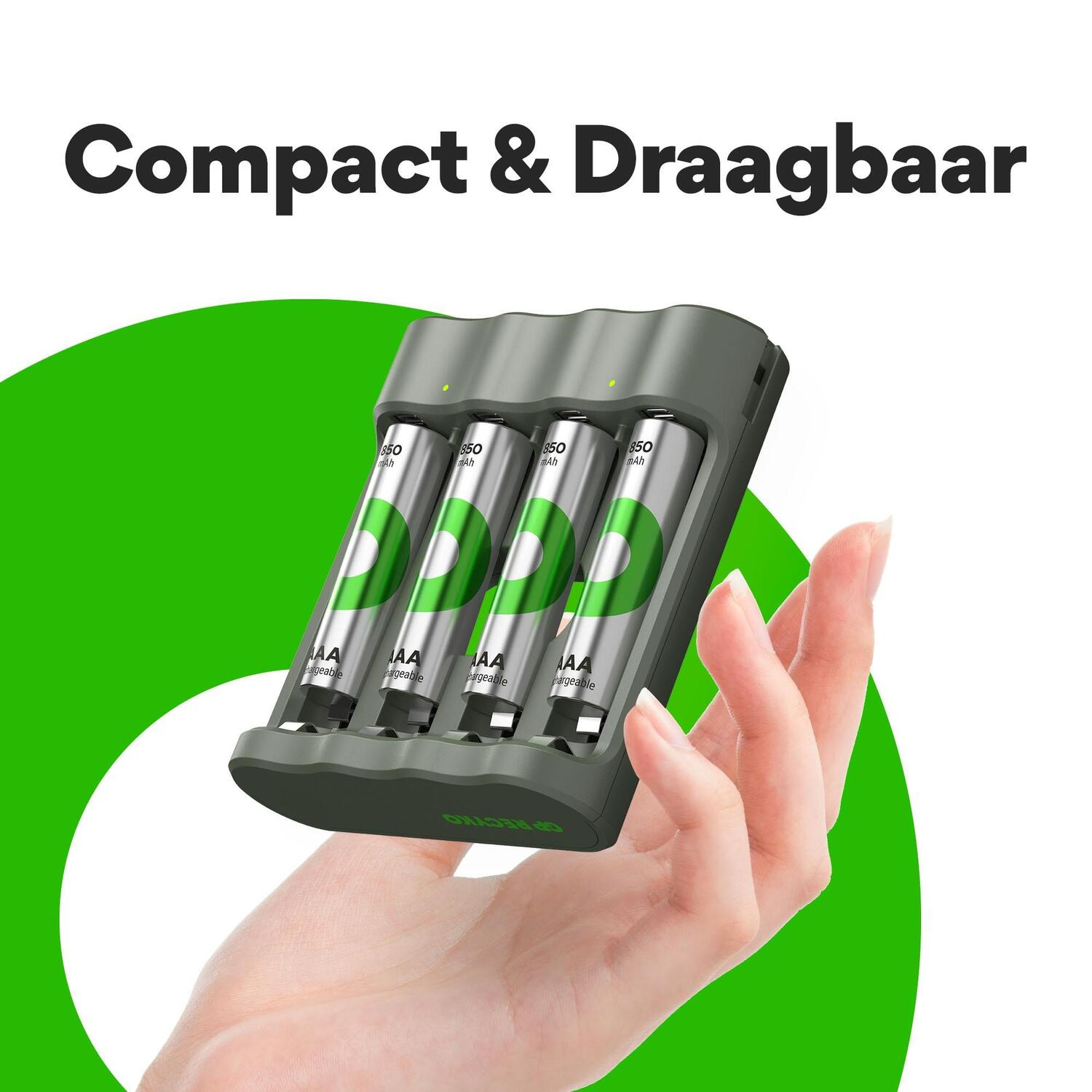 A hand holding a charger with four AA batteries, against a green and white background.