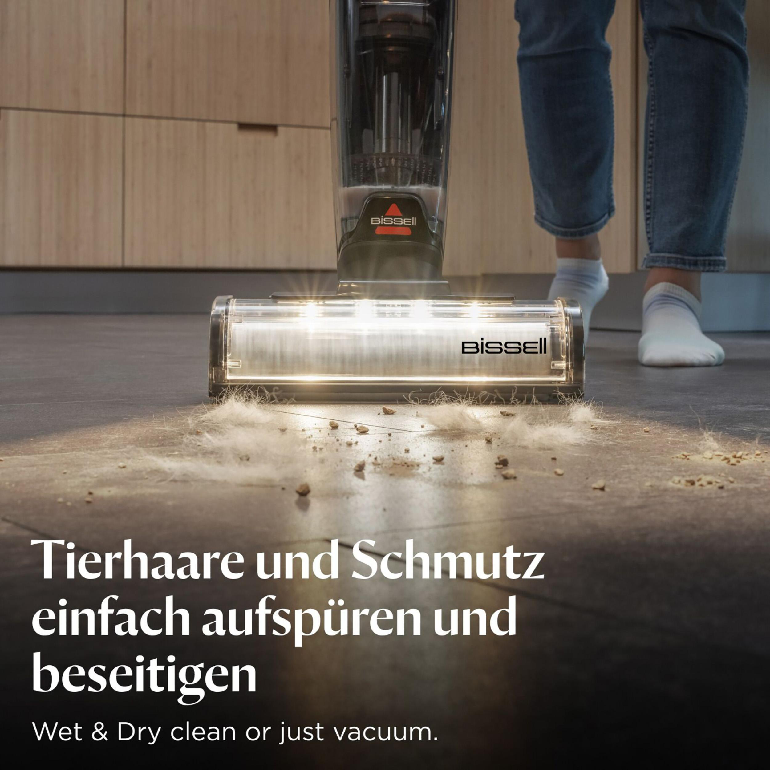 Bissell Staubsauger in Aktion. Der Saugkopf reinigt den Boden und entfernt Haare und Schmutz.