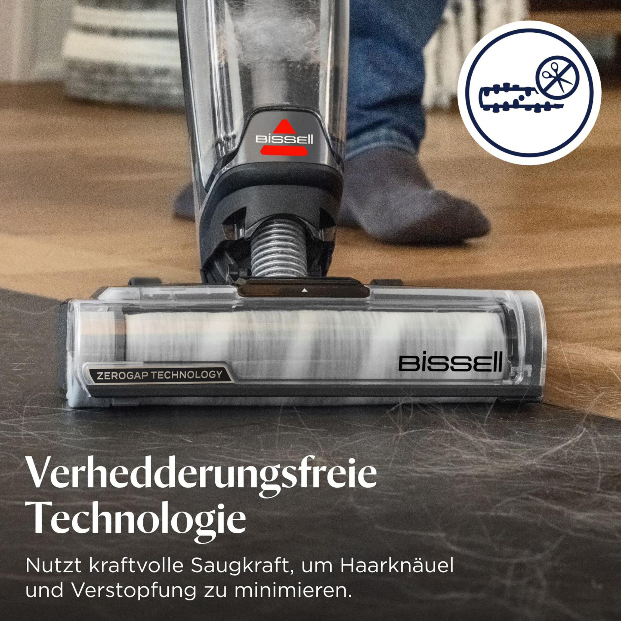 Bissell Staubsauger mit rotierendem Bürstenkopf und deutschem Text, auf Holzboden.