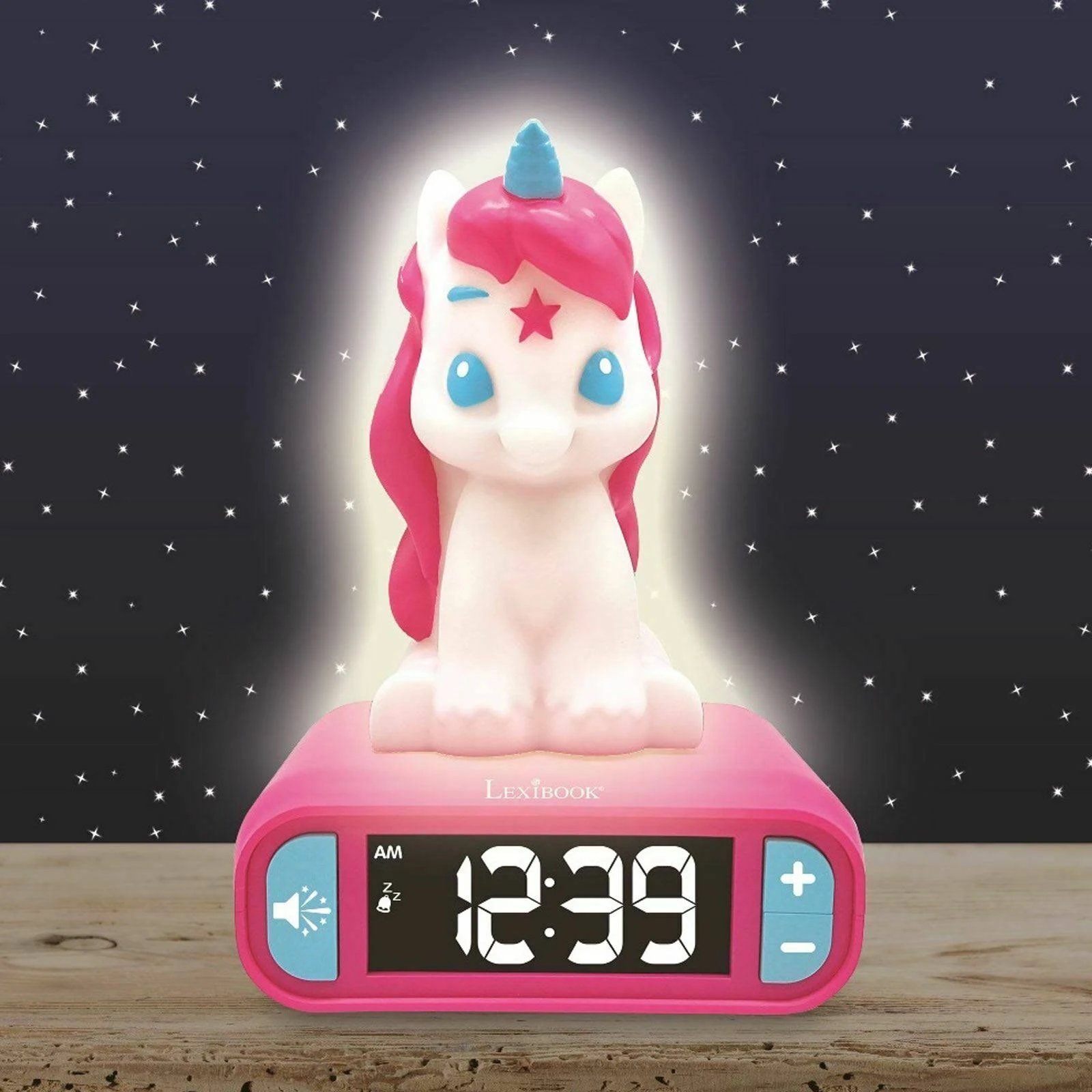 Despertador unicornio rosa con pantalla digital. Fondo de cielo nocturno.