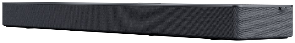 Długi, czarny soundbar z teksturowaną powierzchnią. Soundbar jest prostokątny i ma elegancki design.