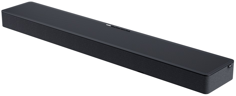Czarny soundbar, długi i cienki. Ma siatkę otworów. Białe tło.