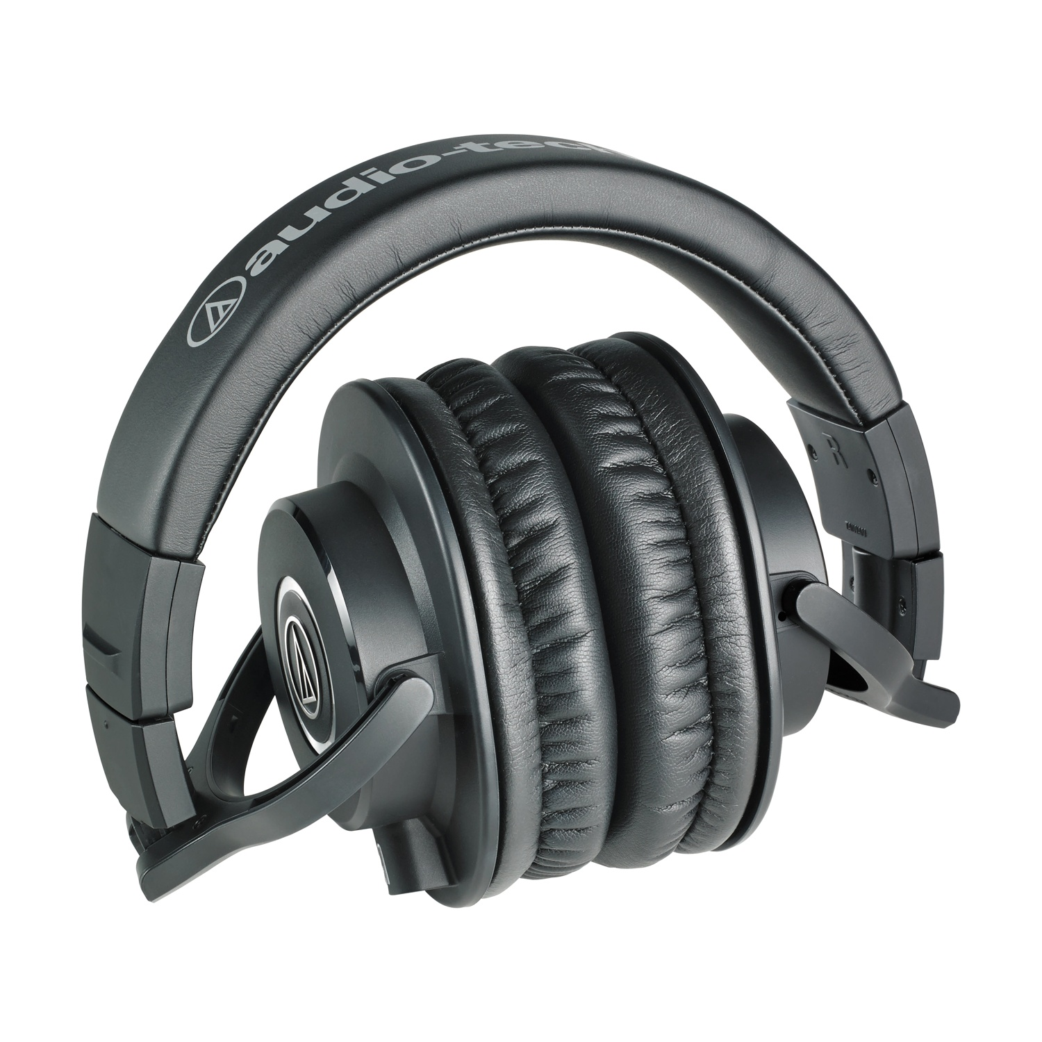 Cuffie nere piegate. Logo Audio-Technica sulla fascia. Padiglioni auricolari visibili.