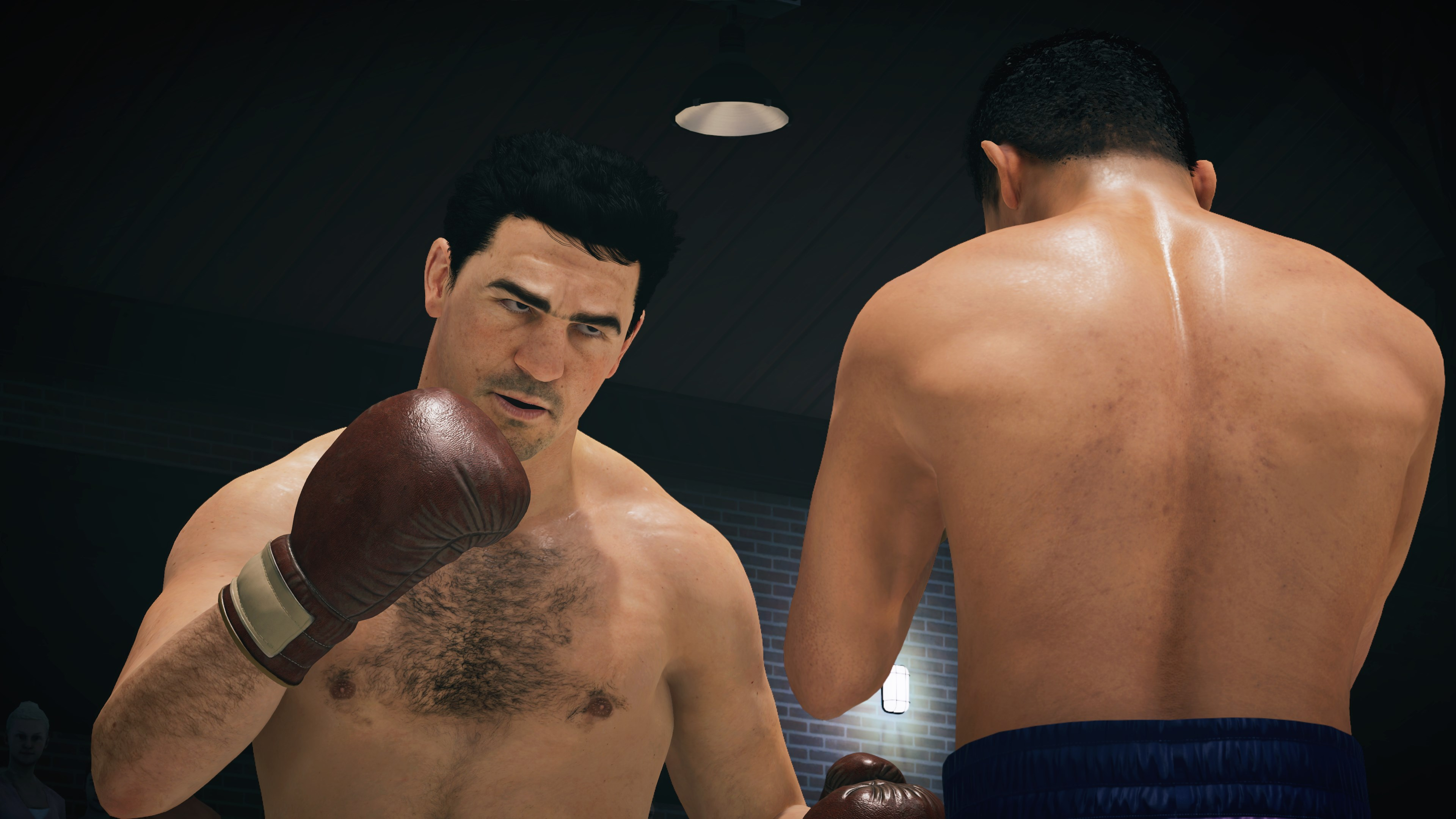 Deux boxeurs sur un ring, l'un avec des gants, se faisant face.