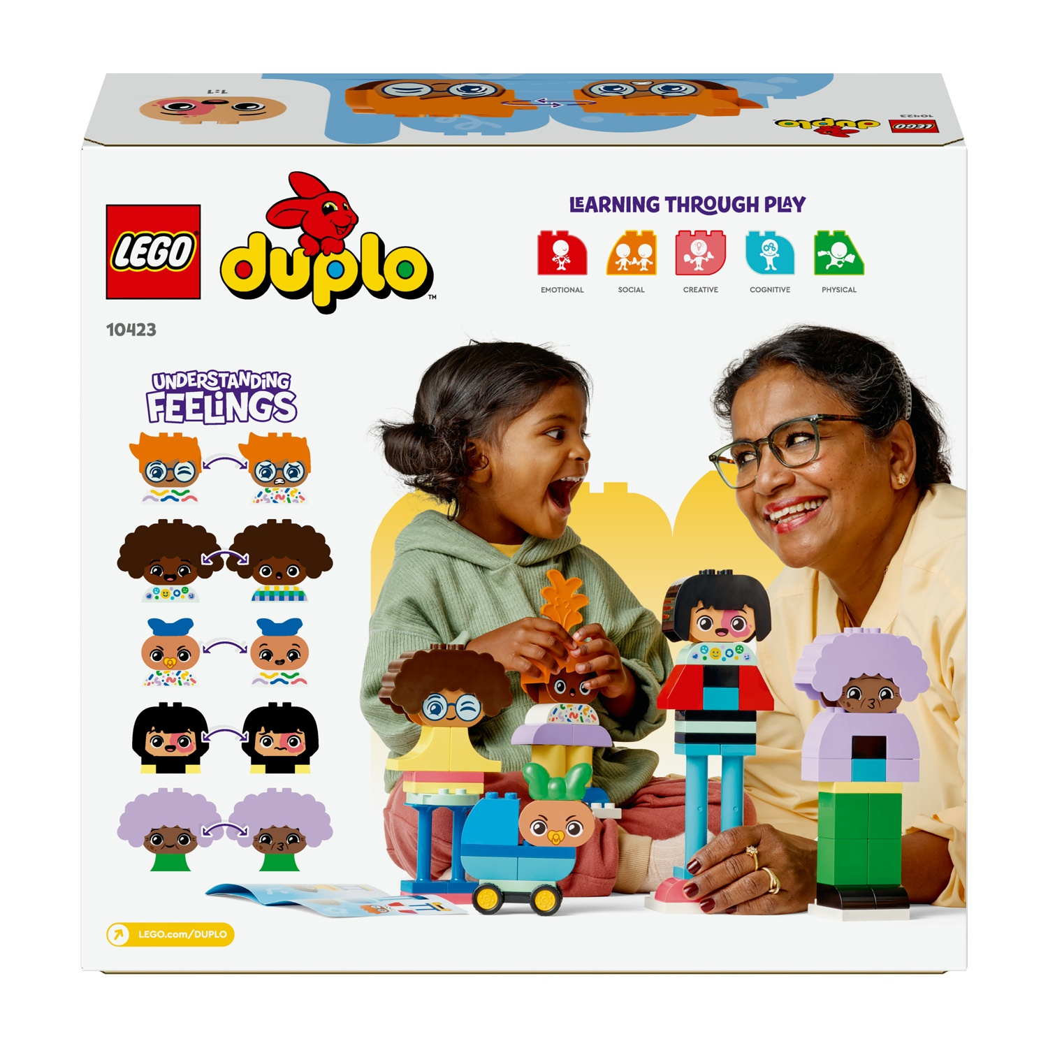 Un bambino e un adulto che giocano con i mattoncini Lego Duplo.