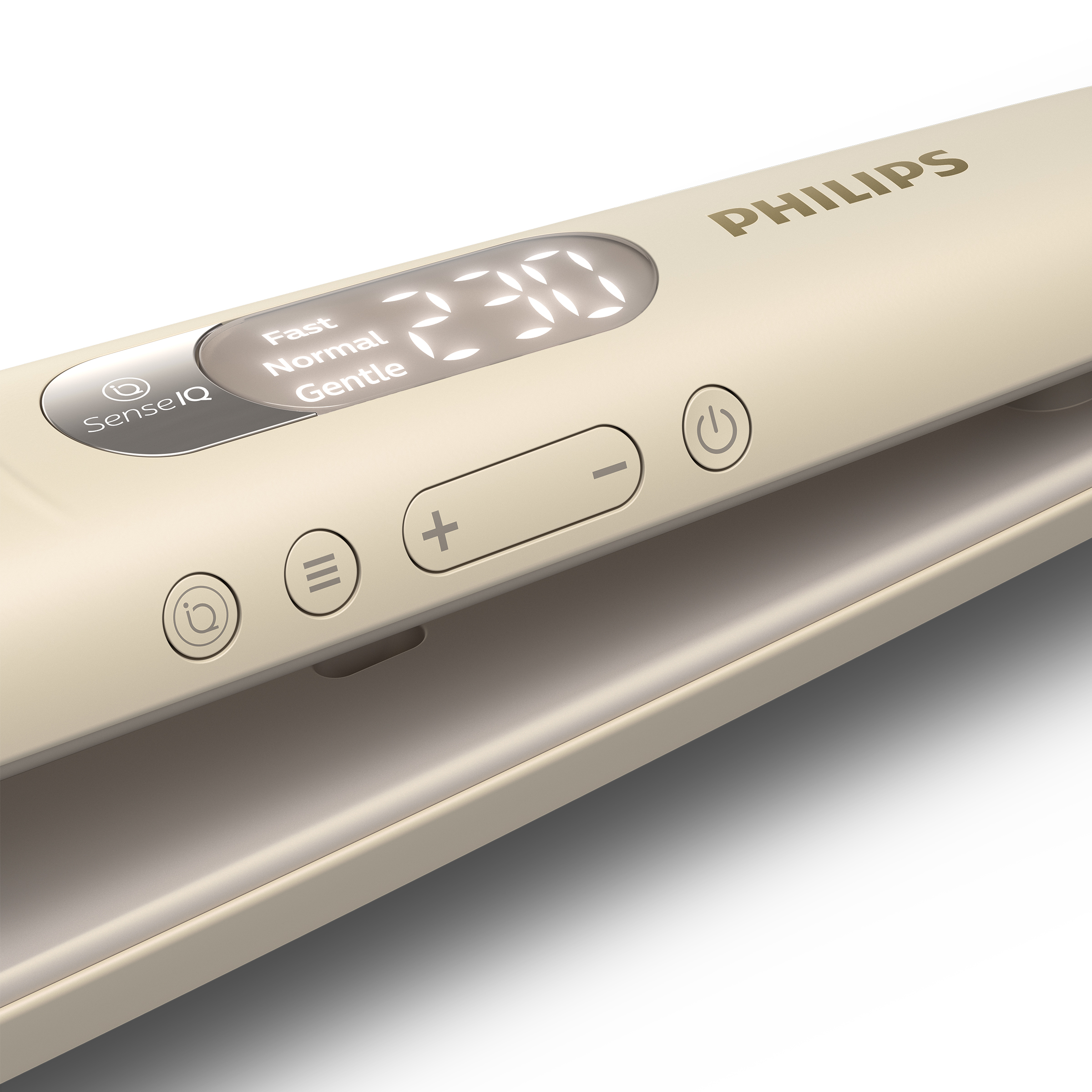Zbliżenie beżowej prostownicy Philips z wyświetlaczem cyfrowym, pokazującym temperaturę.
