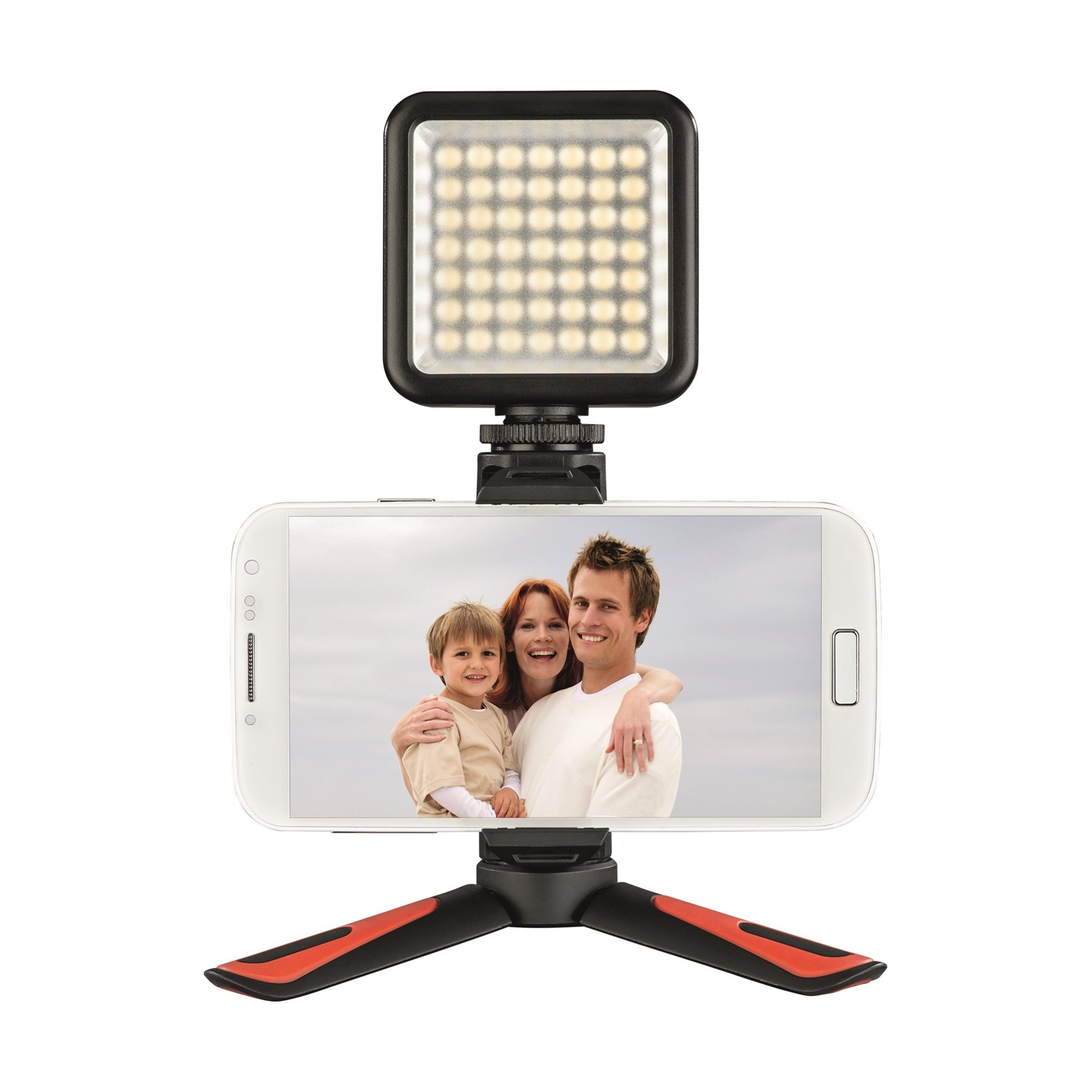 Uno smartphone con una foto di famiglia, collegato a un piccolo treppiede con una luce.