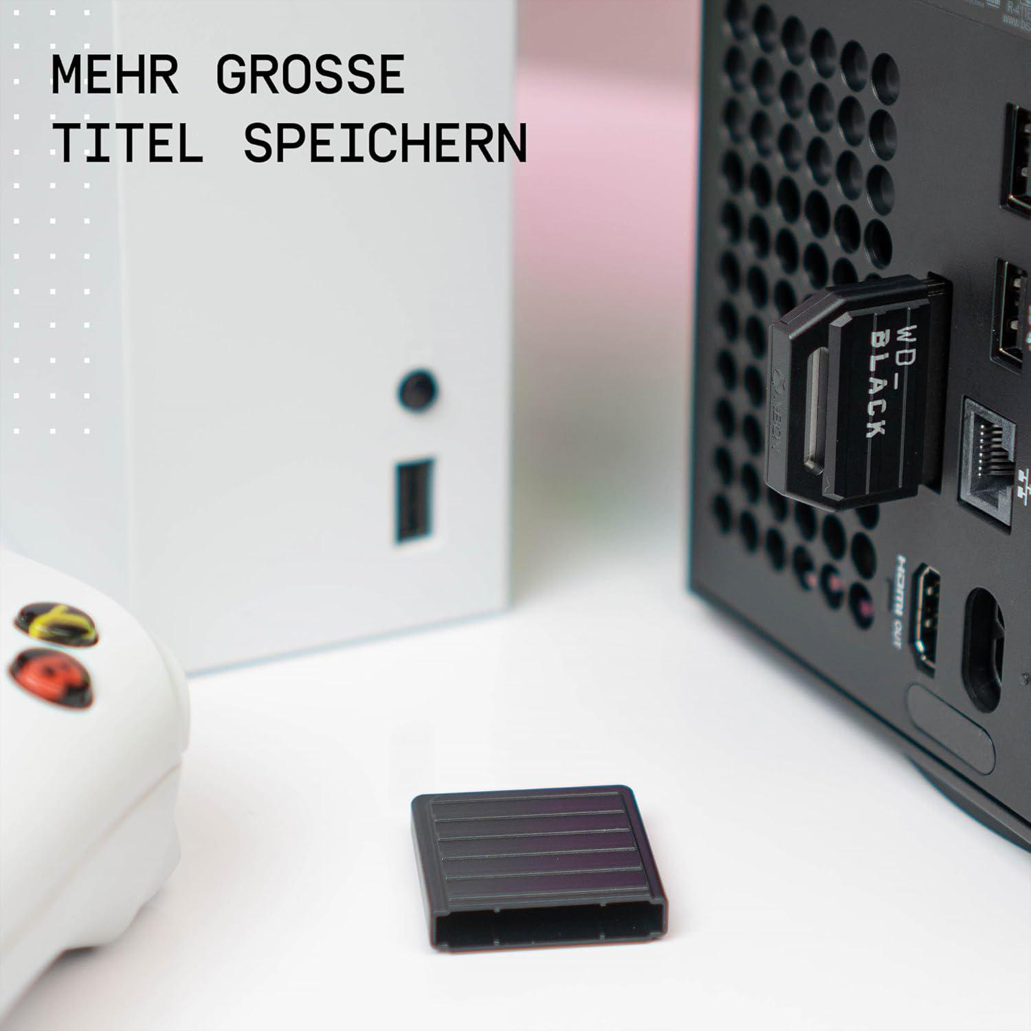 Nahaufnahme eines schwarzen Geräts, das an einem weißen Gerät befestigt ist.