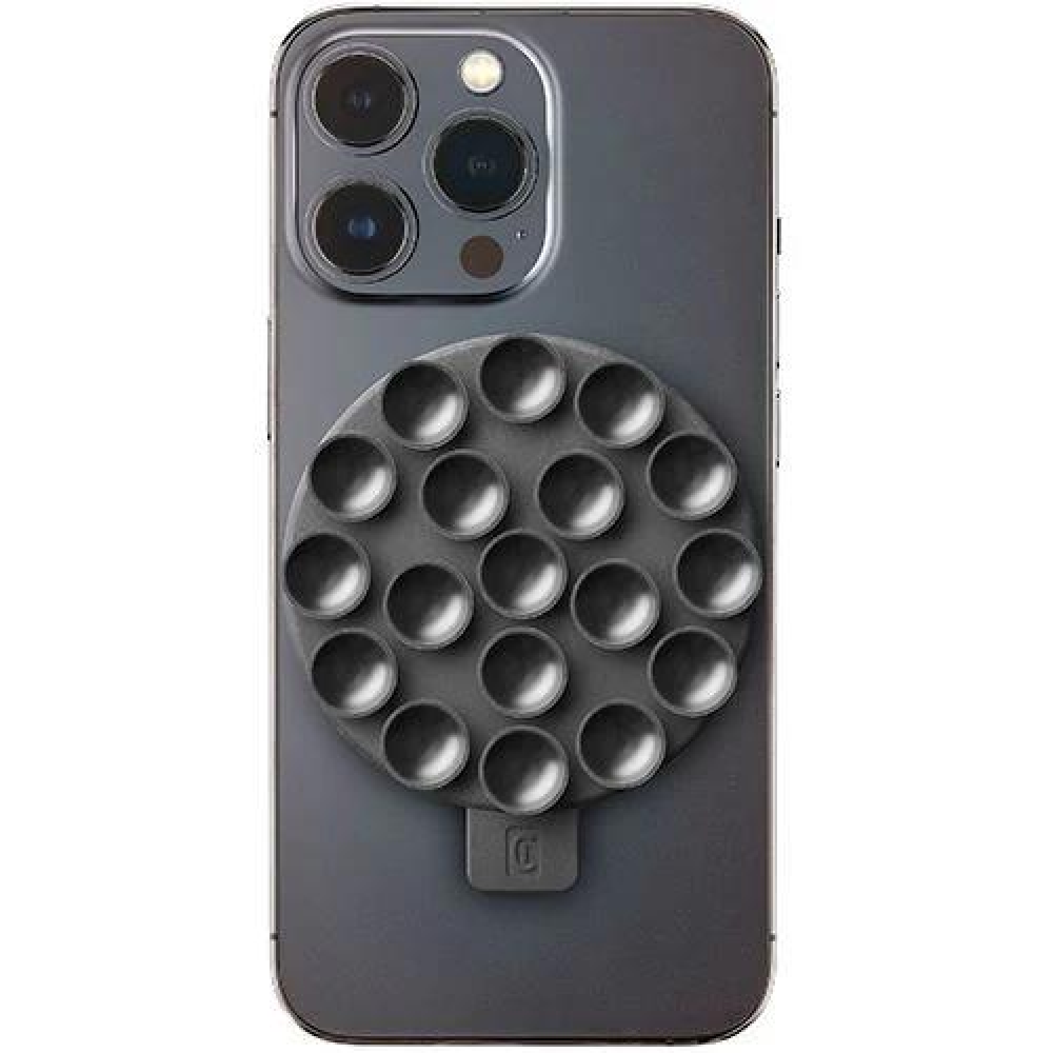 Un teléfono negro con un accesorio magnético redondo con ventosas. El accesorio es negro.