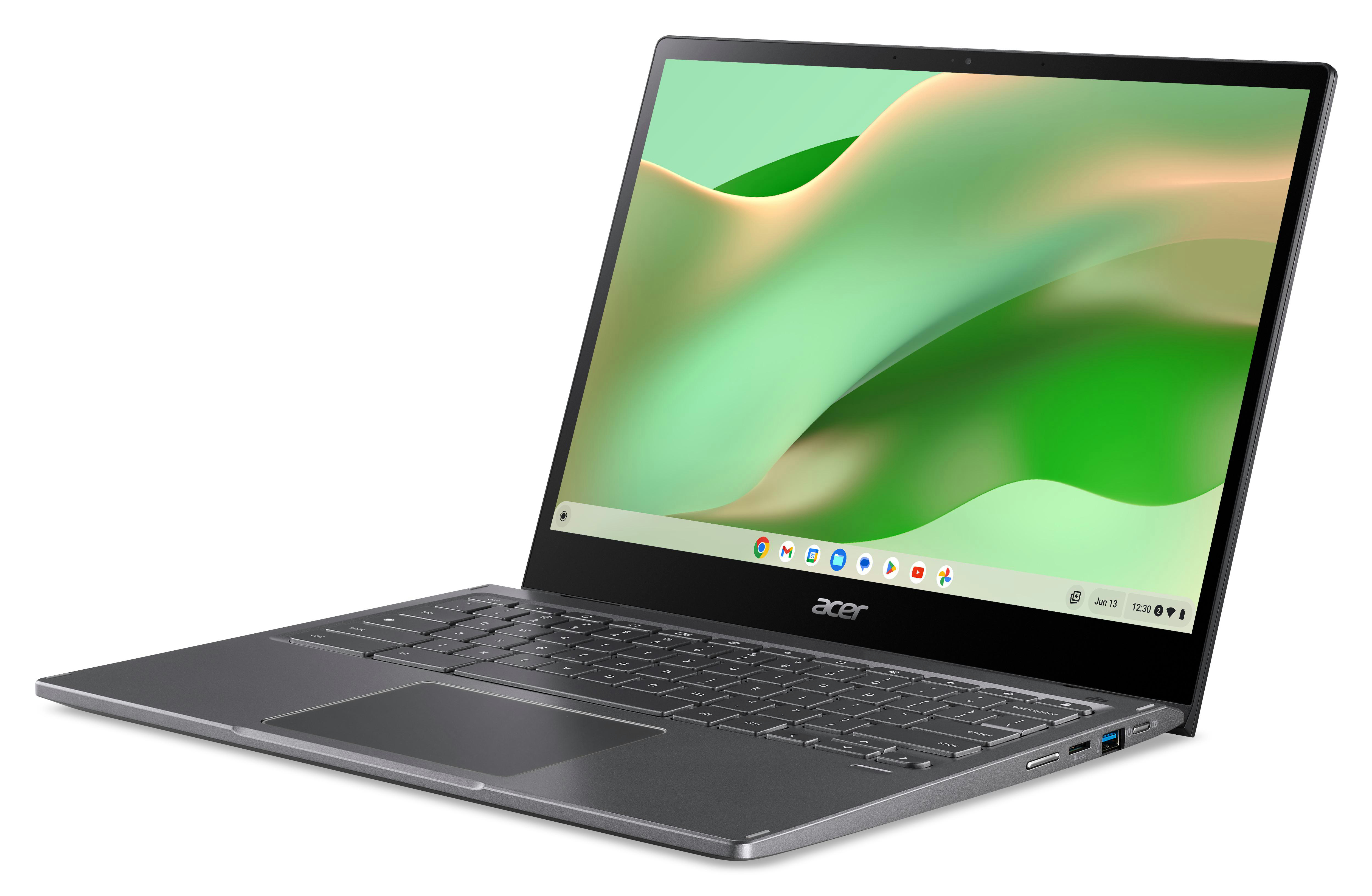 Grauer Laptop auf Weiß. Der Bildschirm zeigt grüne und gelbe abstrakte Kunst.