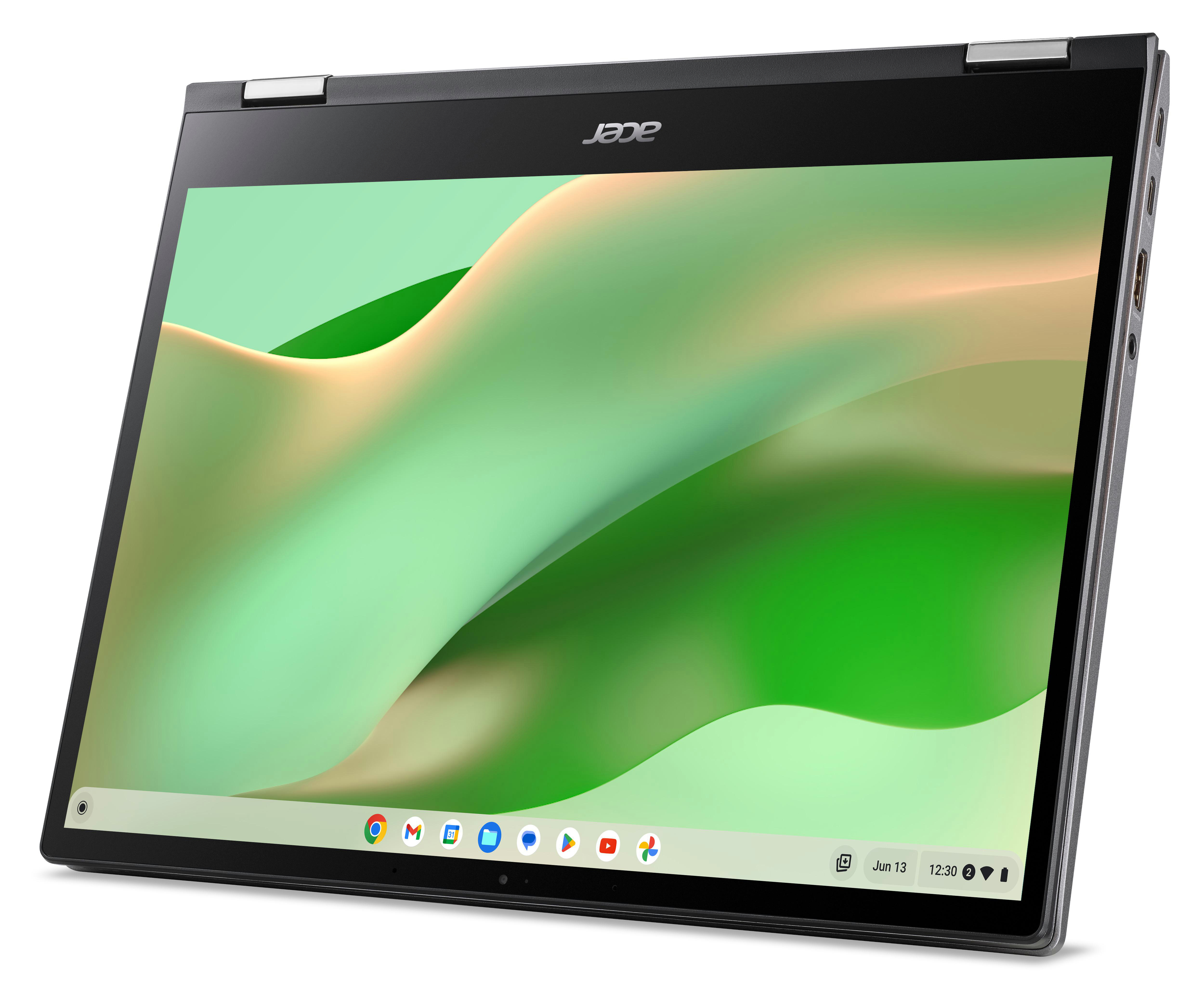 Ein Laptop mit einem grünen und gelben abstrakten Hintergrund auf dem Bildschirm.