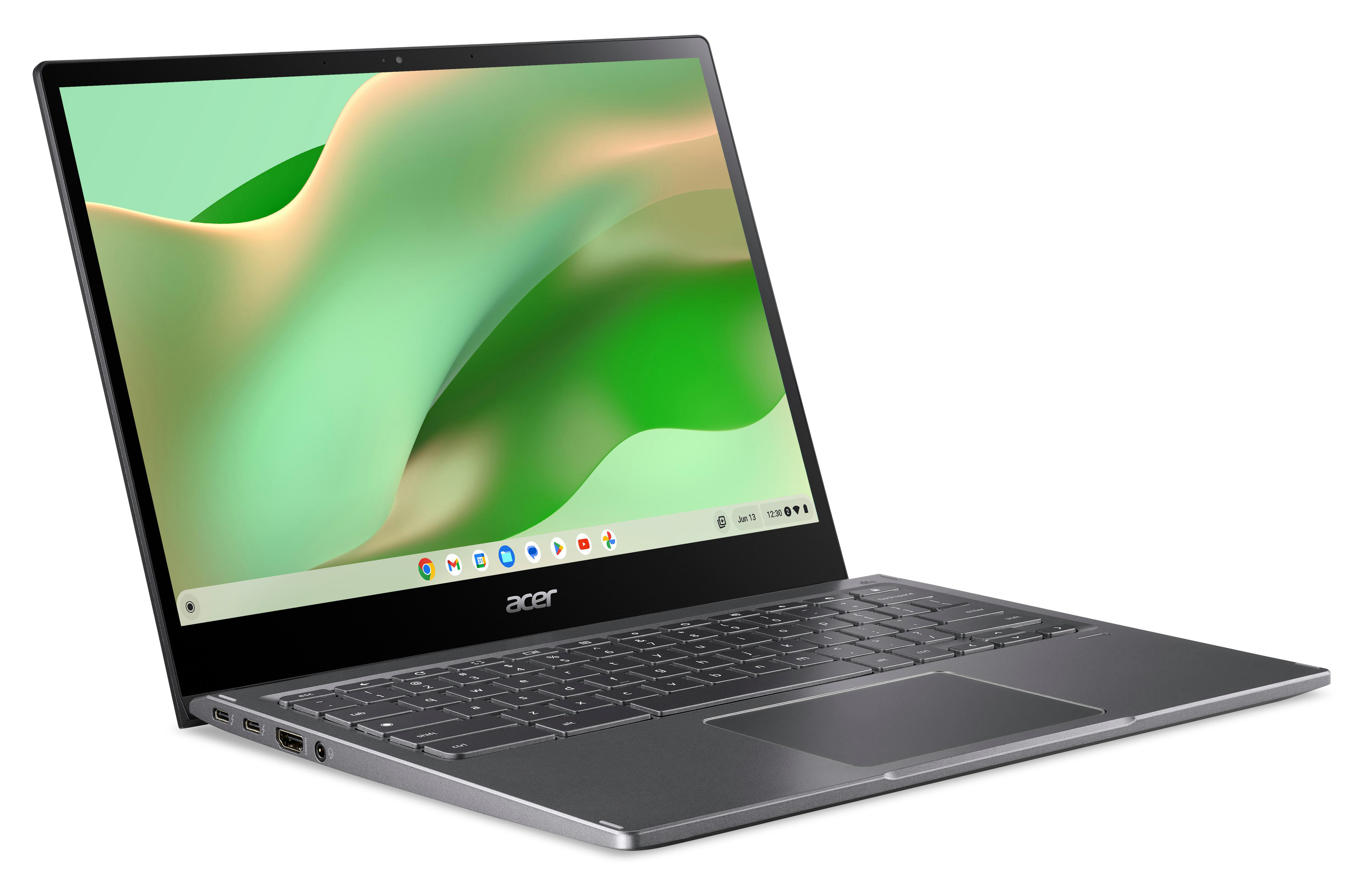 Graues Acer Laptop, geöffnet, mit grünem Desktop-Bildschirm.