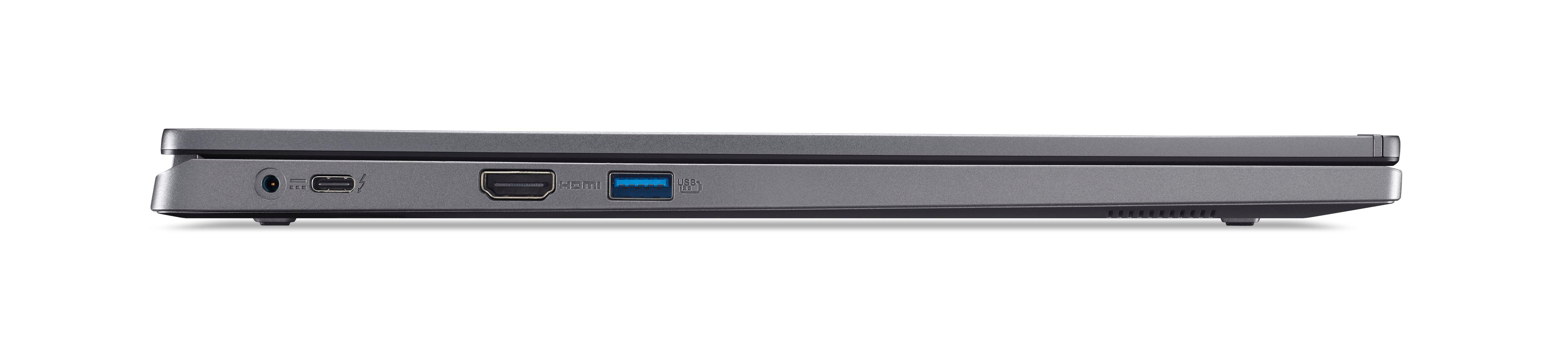 Seitenansicht eines geschlossenen Laptops. Anschlüsse sichtbar. Silbernes Gehäuse, weißer Hintergrund.
