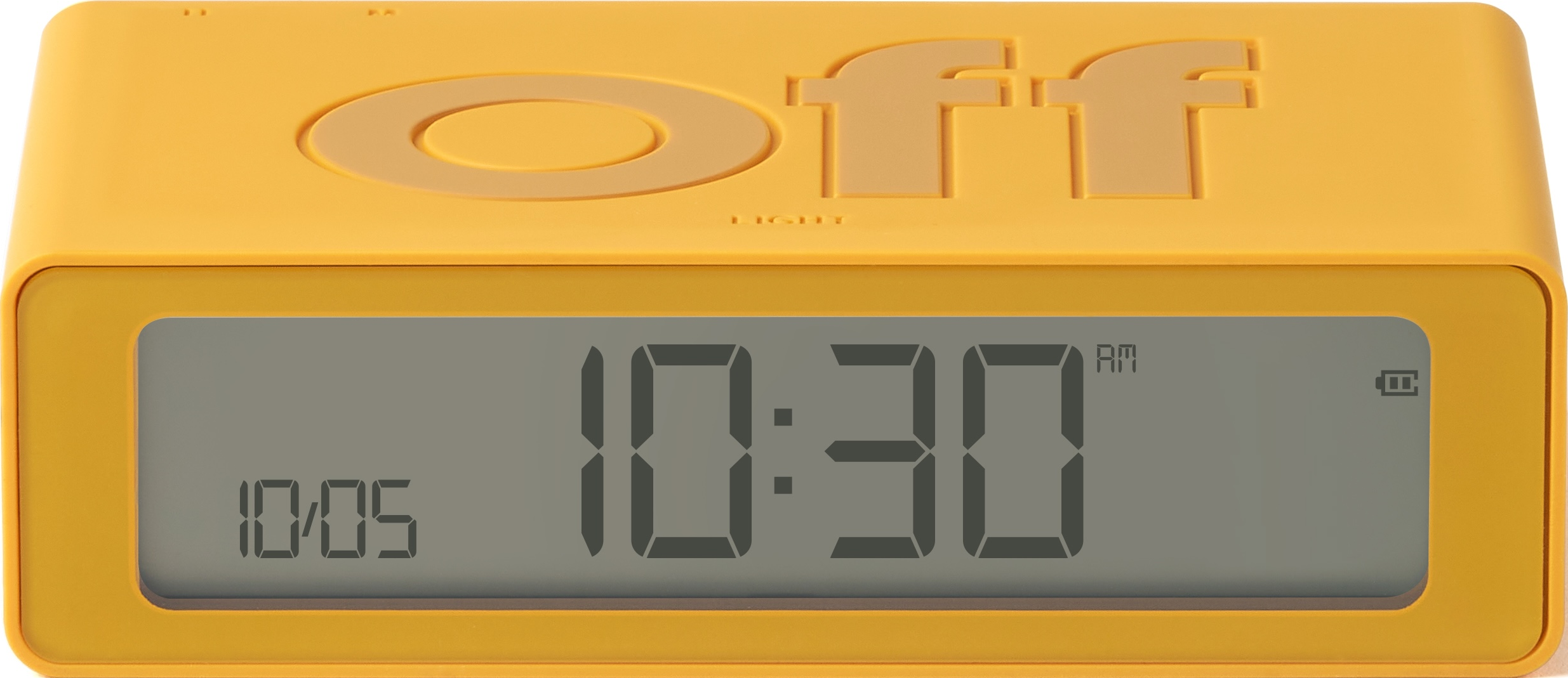 Réveil jaune avec le mot « off ». L'horloge affiche 10h30 sur un affichage numérique.
