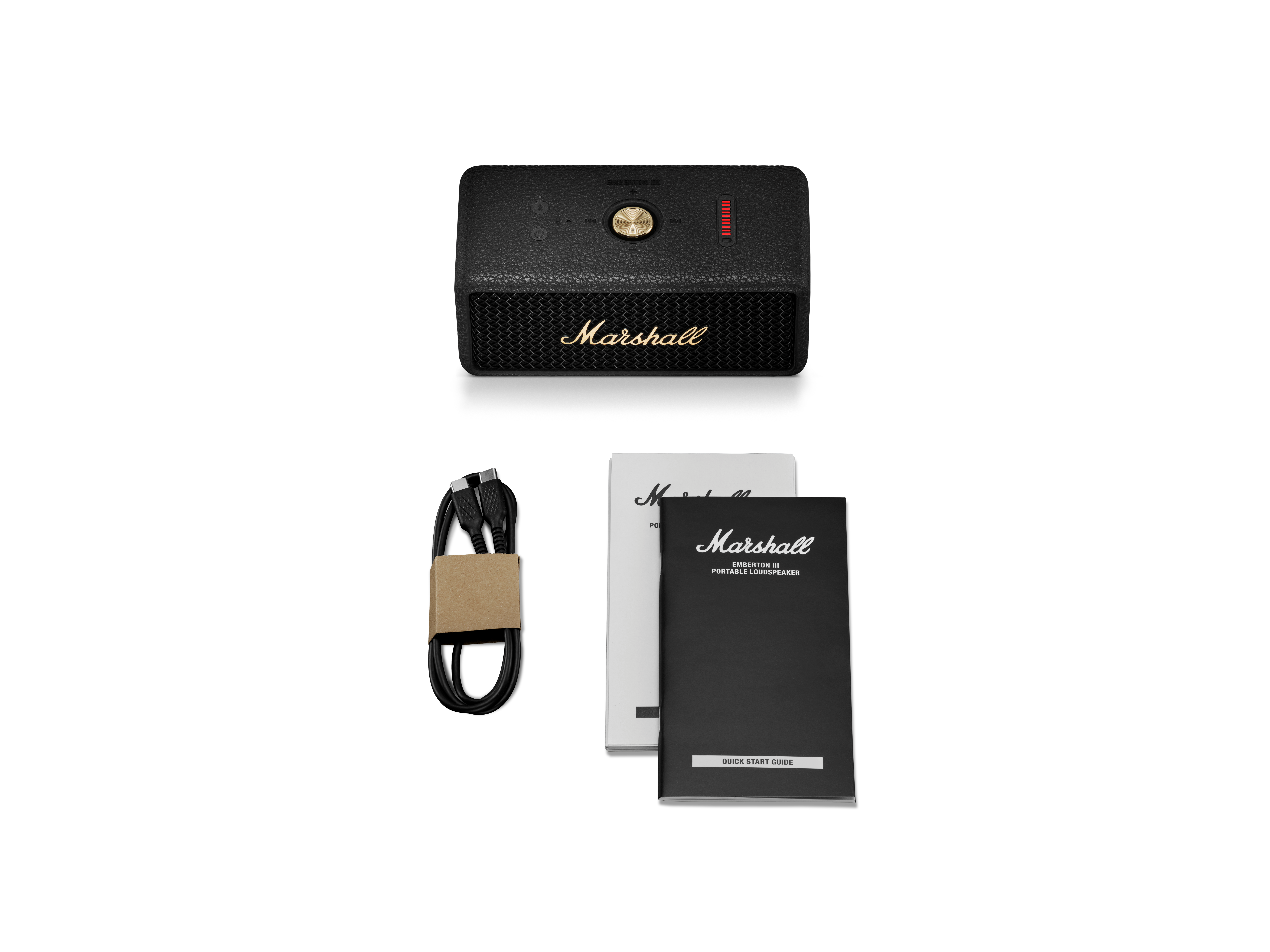 Siyah Marshall hoparlör, USB kablosu ve iki kullanım kılavuzu.