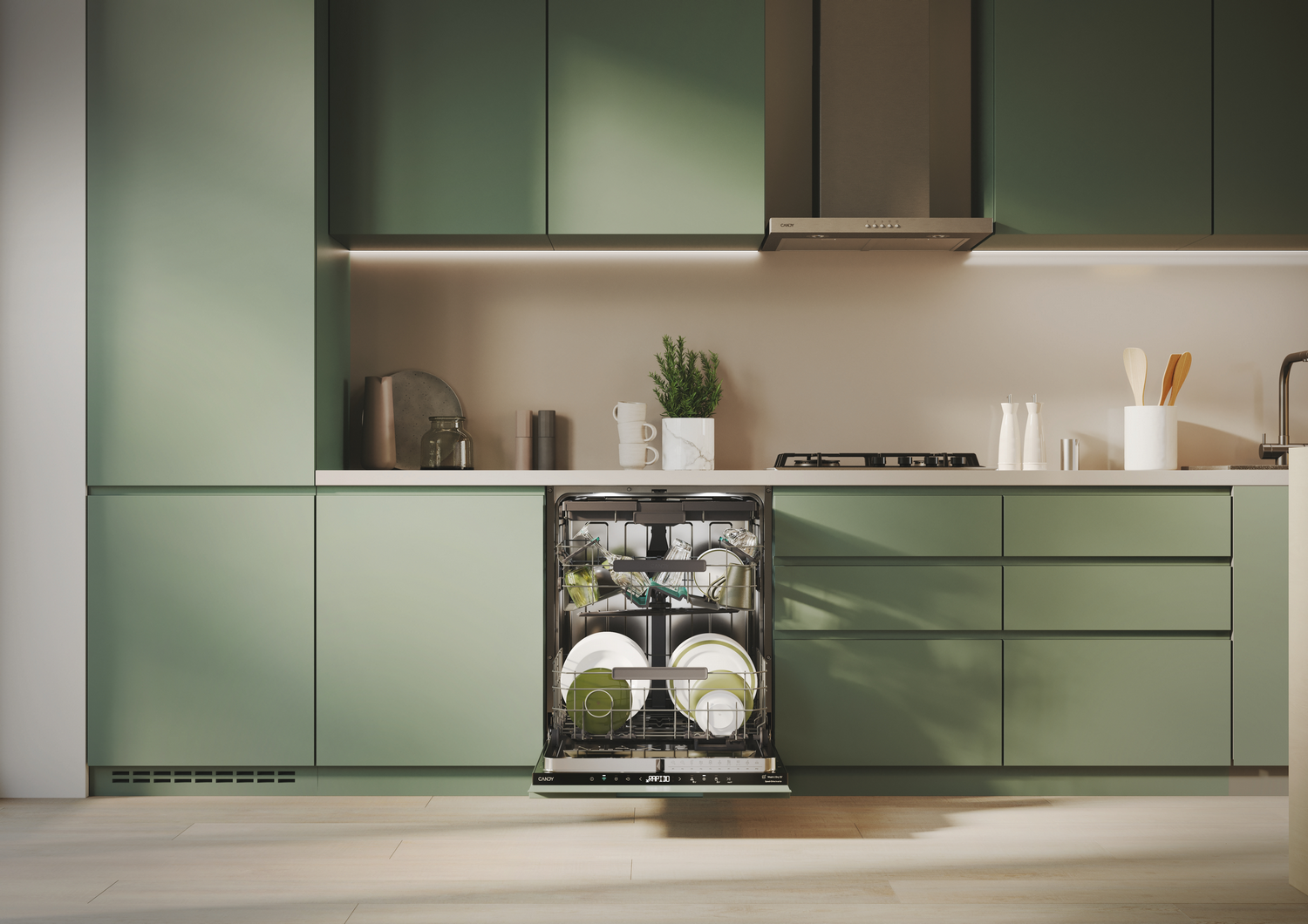 Una cocina con gabinetes verdes, un lavavajillas con puerta abierta y una campana extractora de acero inoxidable.