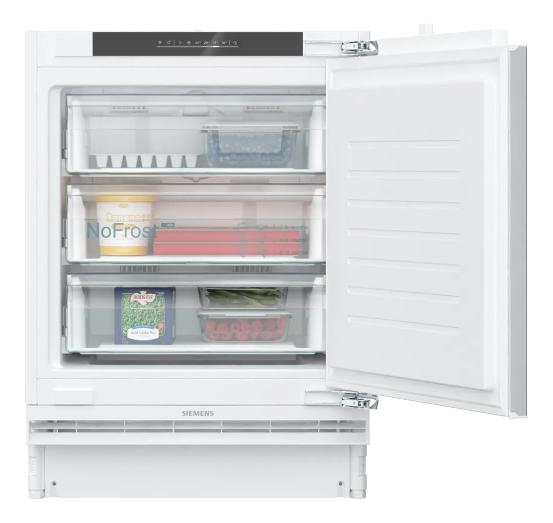 Frigorifero Siemens bianco con porta aperta. All'interno cassetti con cibo, tra cui bacche e piselli.