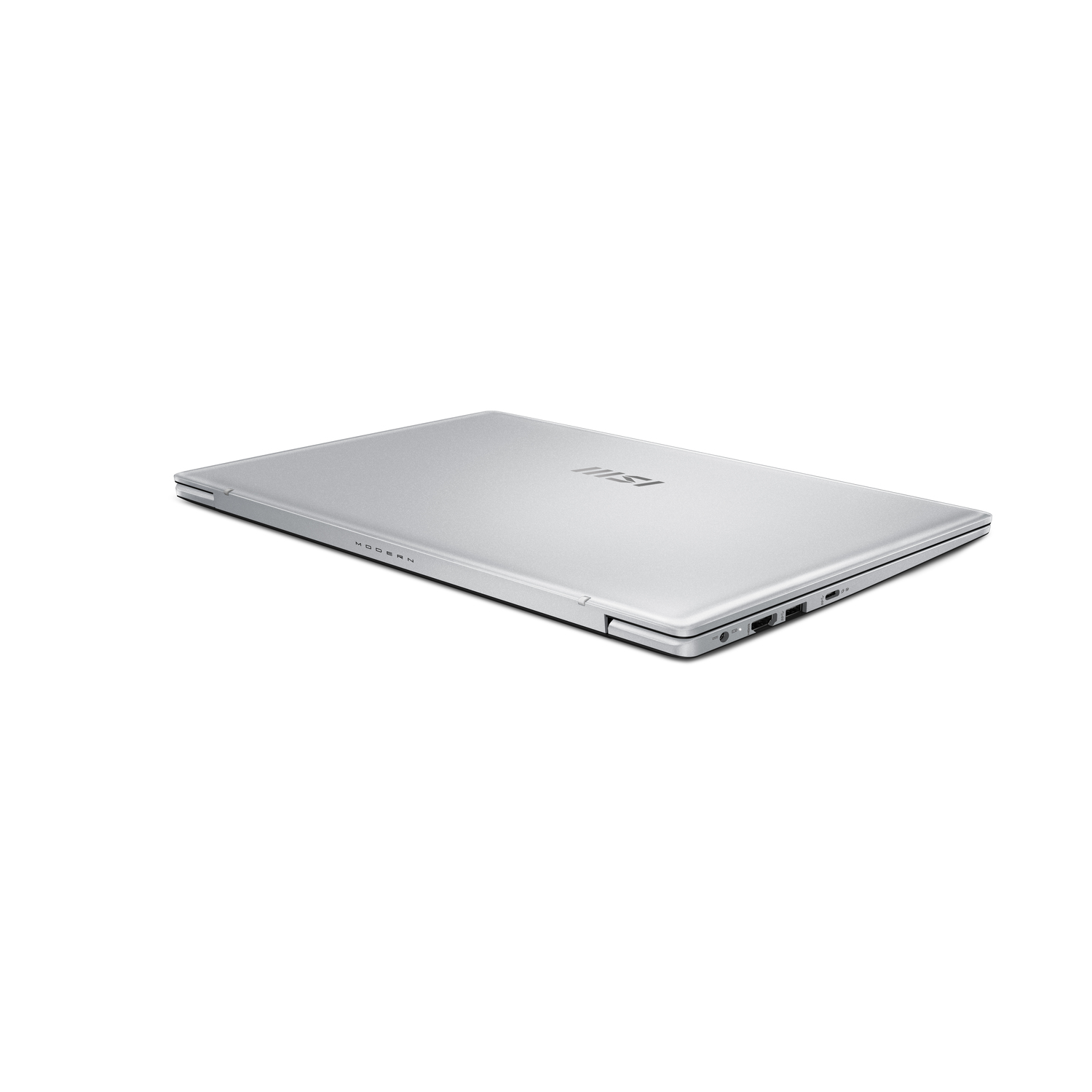 Closed silver laptop on a white background, side view.