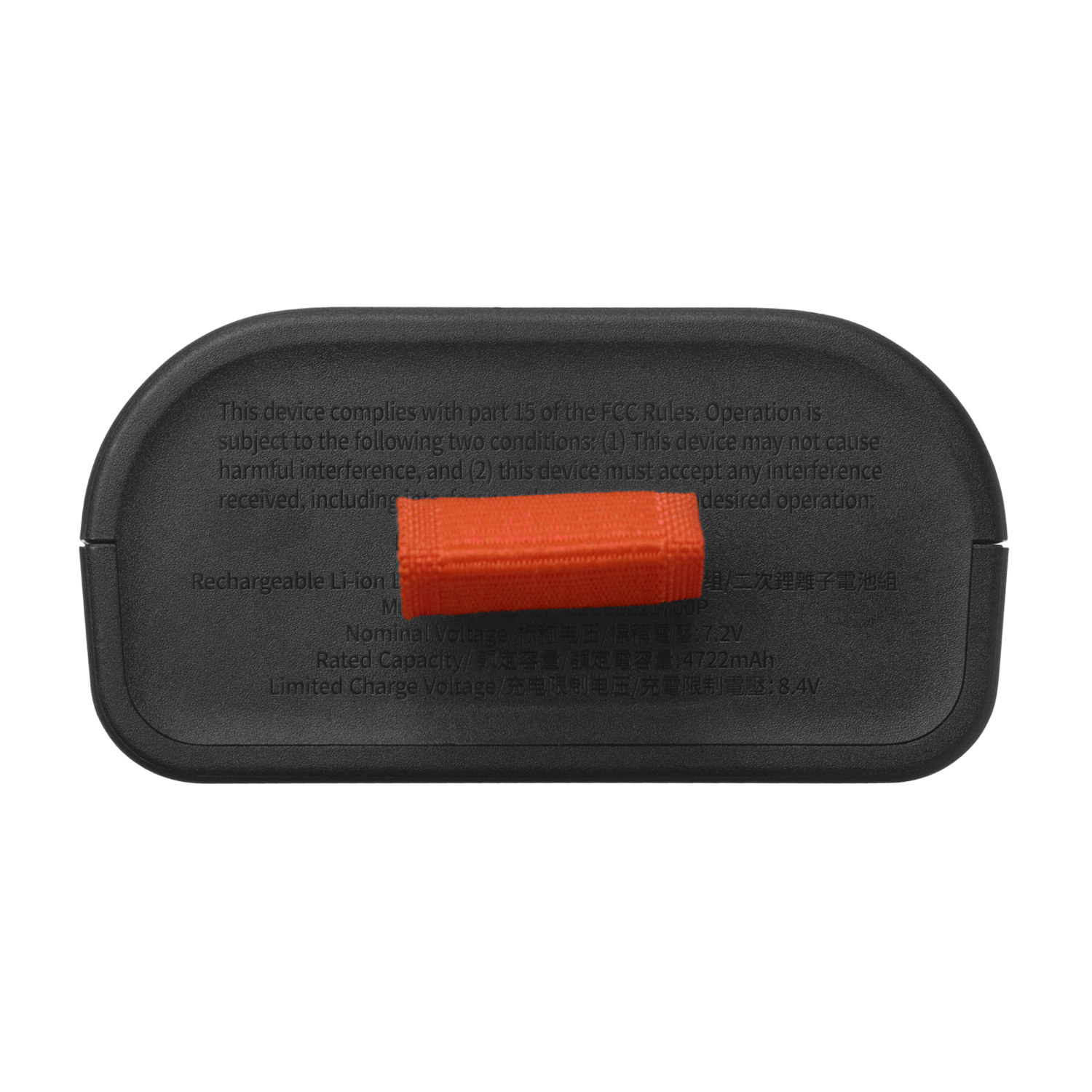 Vue de dessous d'un appareil noir avec un petit morceau rectangulaire orange. Texte et marquages sur l'appareil.