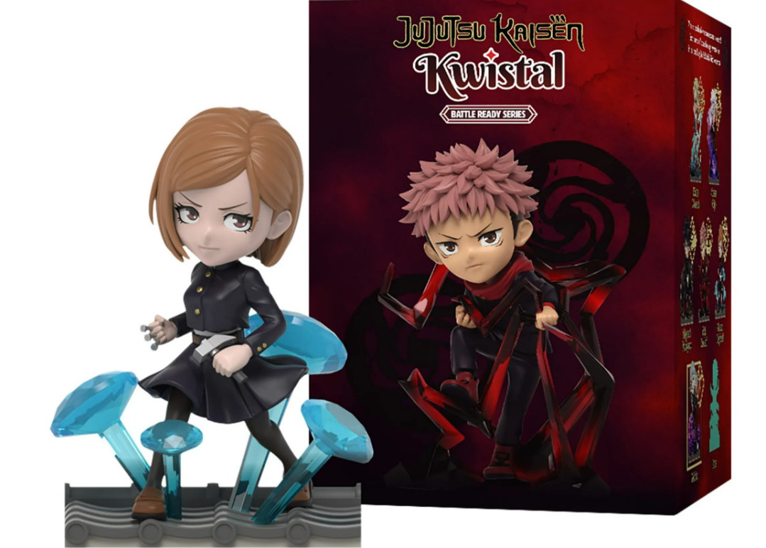 Zwei Anime-Figuren, ein Mädchen und ein Junge, mit einer Box im Hintergrund.