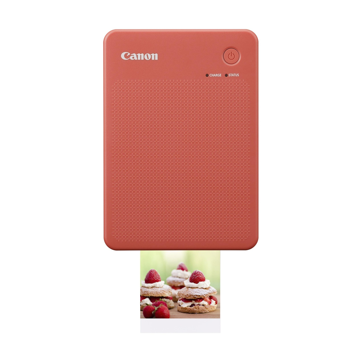 Stampante fotografica Canon color corallo. Sta stampando una foto di dolci con fragole.
