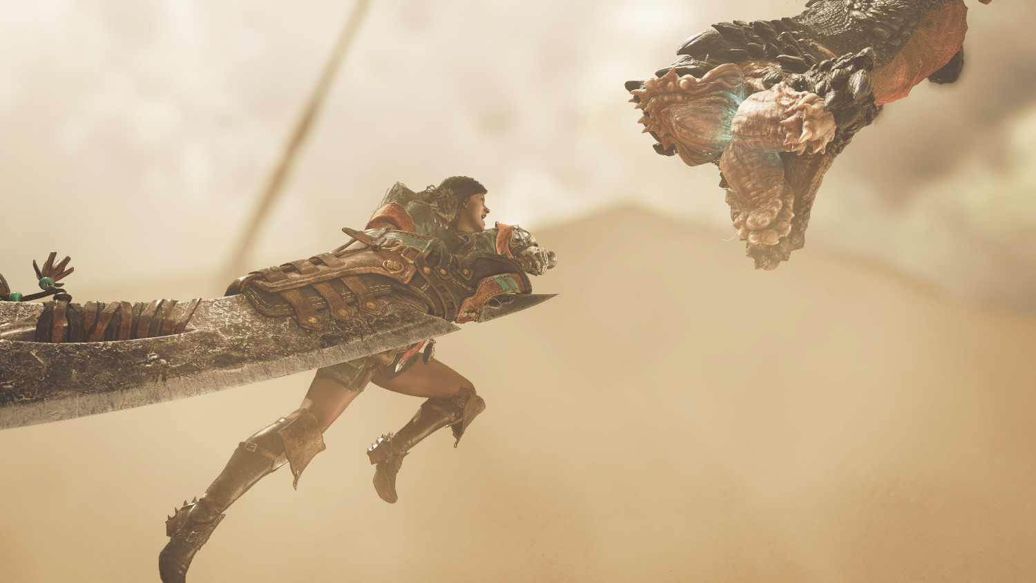 Un personnage maniant une grande épée combattant un monstre dans une scène désertique.