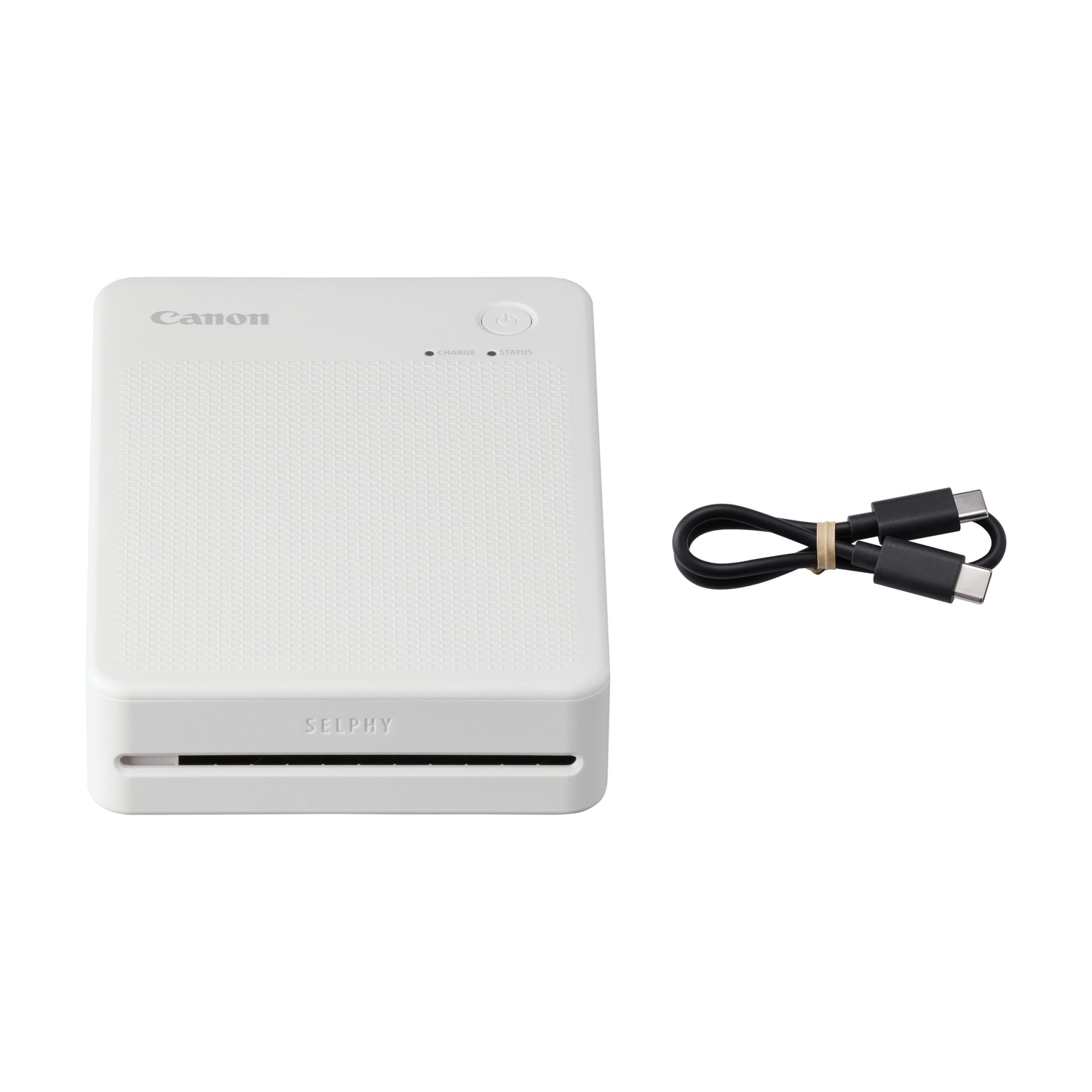 Una stampante Canon Selphy bianca con cavo USB su sfondo bianco.