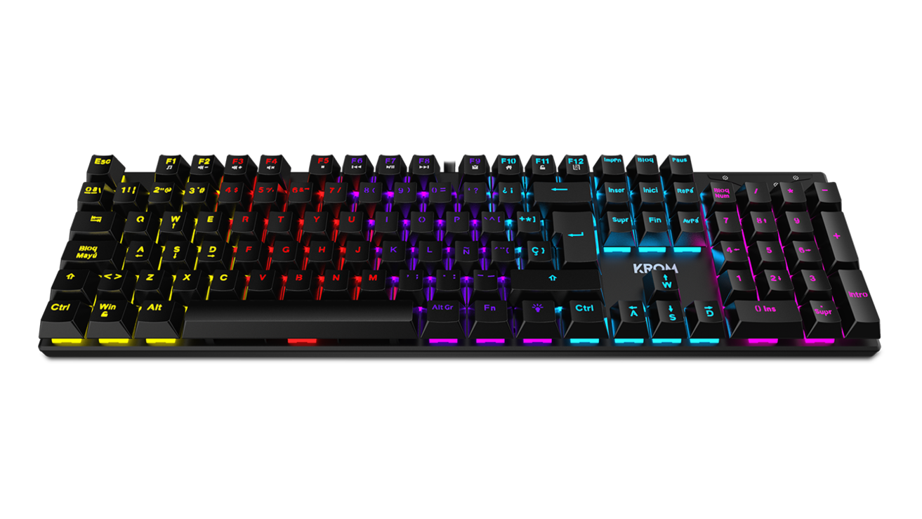 Teclado Krom negro con teclas iluminadas. Las teclas tienen varios colores, sobre fondo negro.