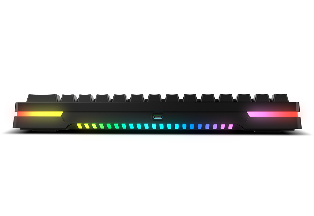 Un teclado negro con luces de colores en los lados y el borde inferior sobre fondo negro.