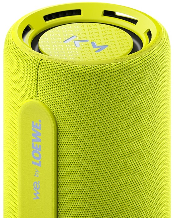 Limonkowo-zielony głośnik cylindryczny z logo LOEWE z boku.