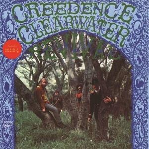 Pochette d'album avec les membres du groupe dans une scène de forêt, avec les mots 'CREEDENCE CLEARWATER REVIVAL' au-dessus.