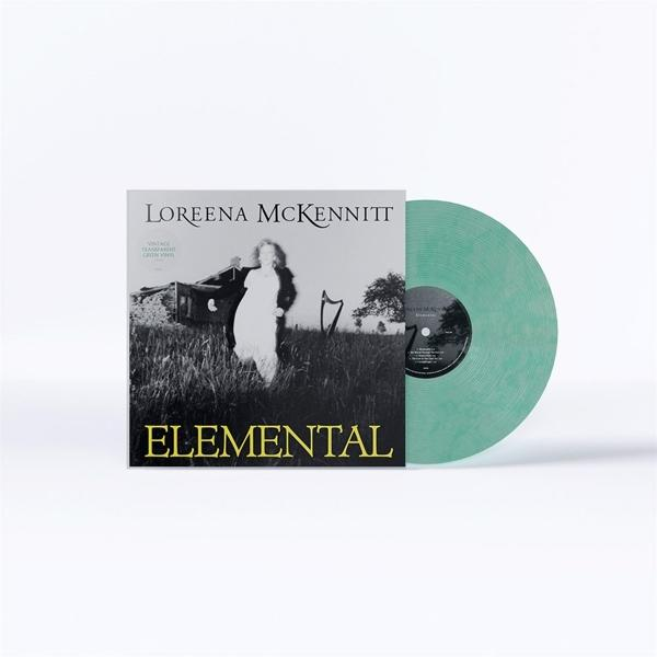 Albumcover: Loreena McKennitt Elemental. Eine Frau in weißem Kleid. Grüne Vinyl-Schallplatte.