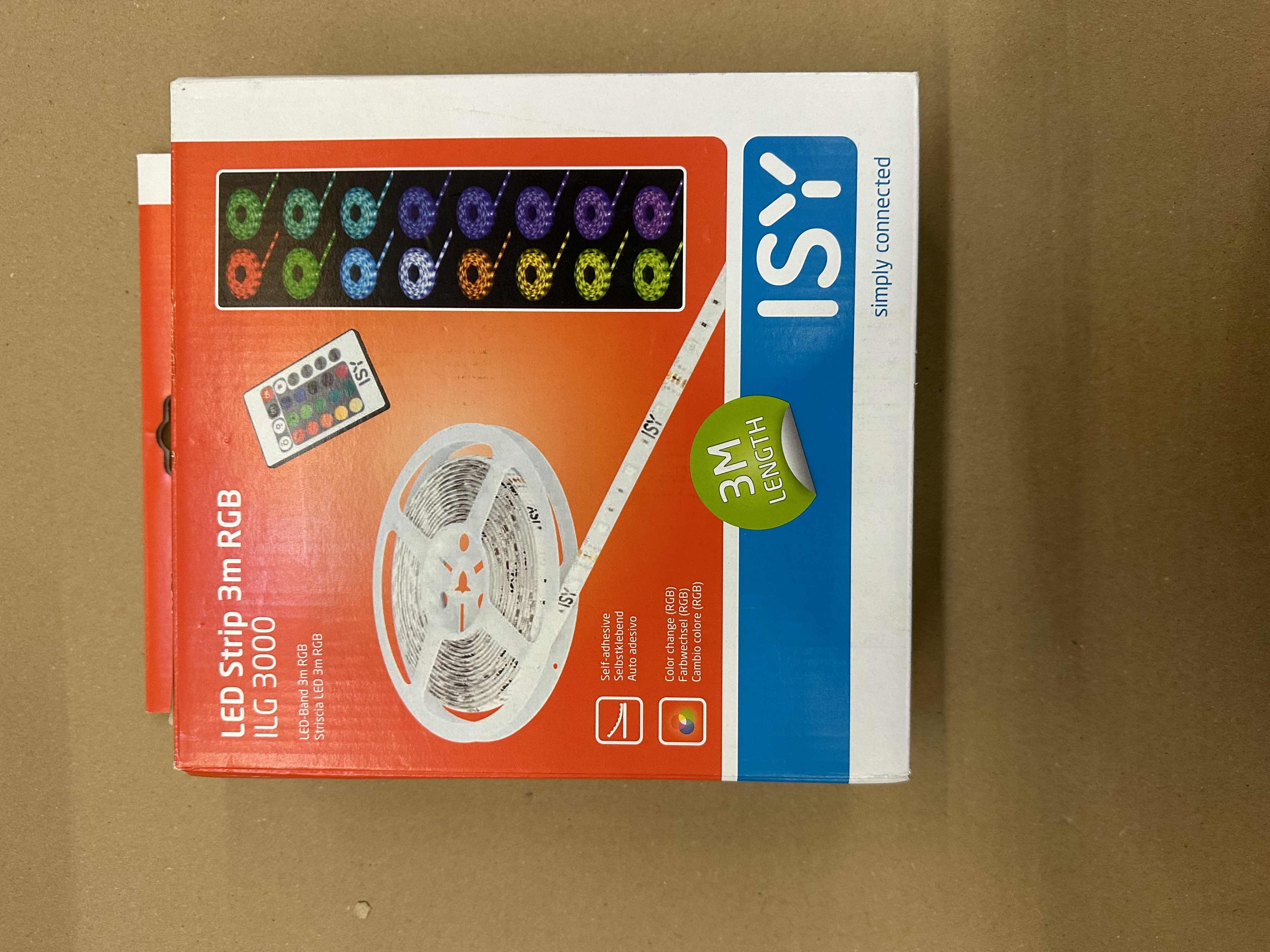 Pudełko z oświetleniem LED, pilotem i różnymi kolorami.