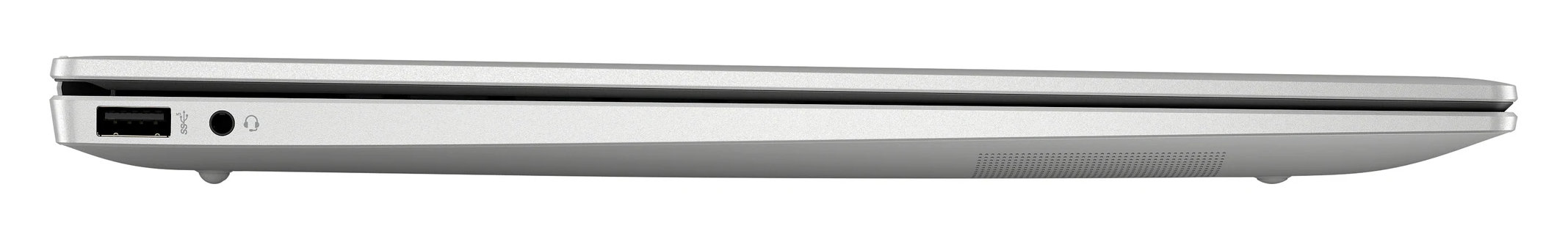 Srebrny laptop widziany z boku. Jest zamknięty. Jest port USB i gniazdo audio.