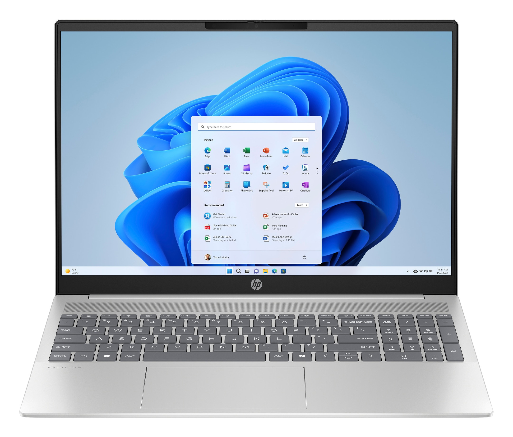 Laptop z interfejsem Windows 11, widoczną klawiaturą, na białej powierzchni.