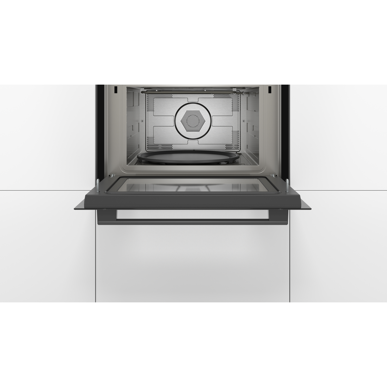A microwave oven with an open door, showing a black plate inside. The background is white.